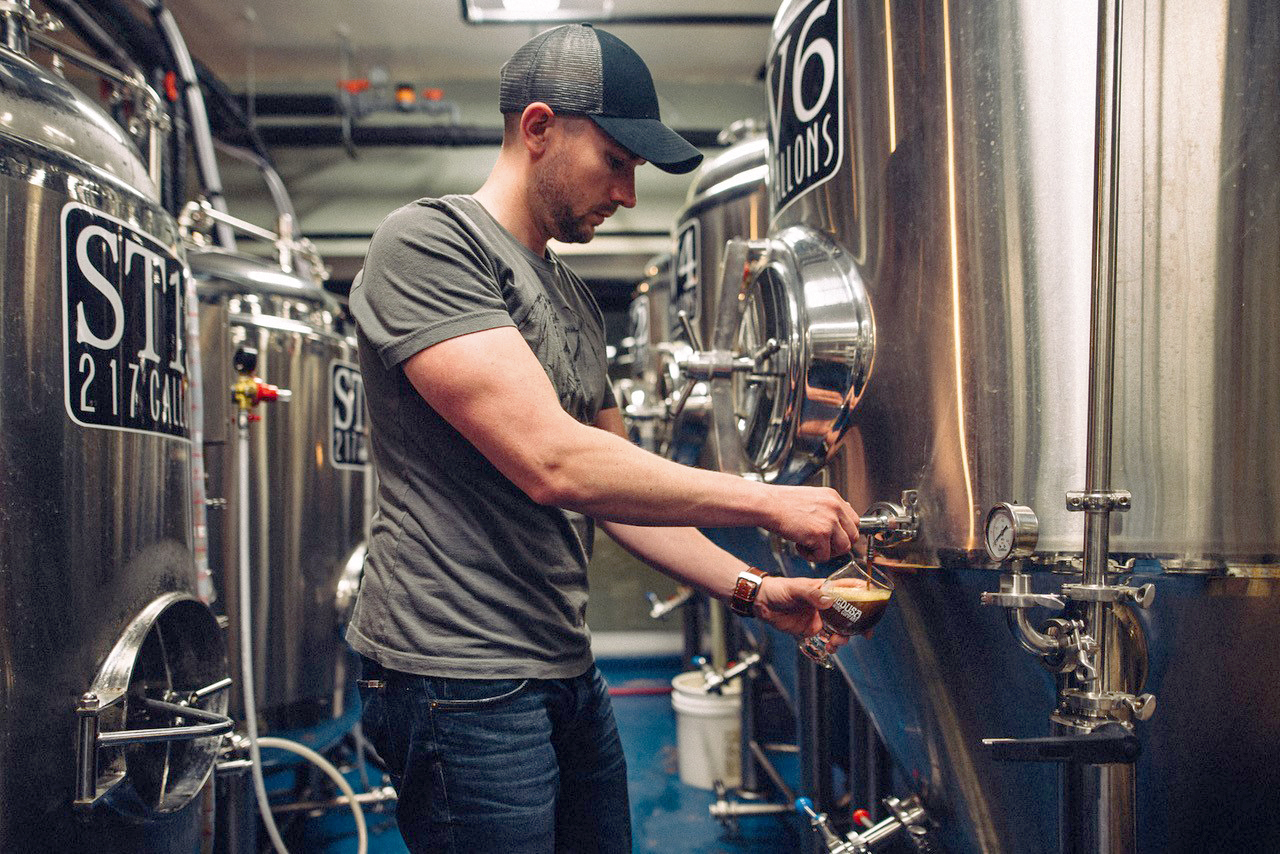 Medusa Brewing Company co-founder Keith Sullivan checks on the beer in the brewing area. &quot;There are very few big breweries that have this family, community, connected feel. That's what we're selling,&quot; he says. (Courtesy of Medusa Brewing Company/Elise Meader)