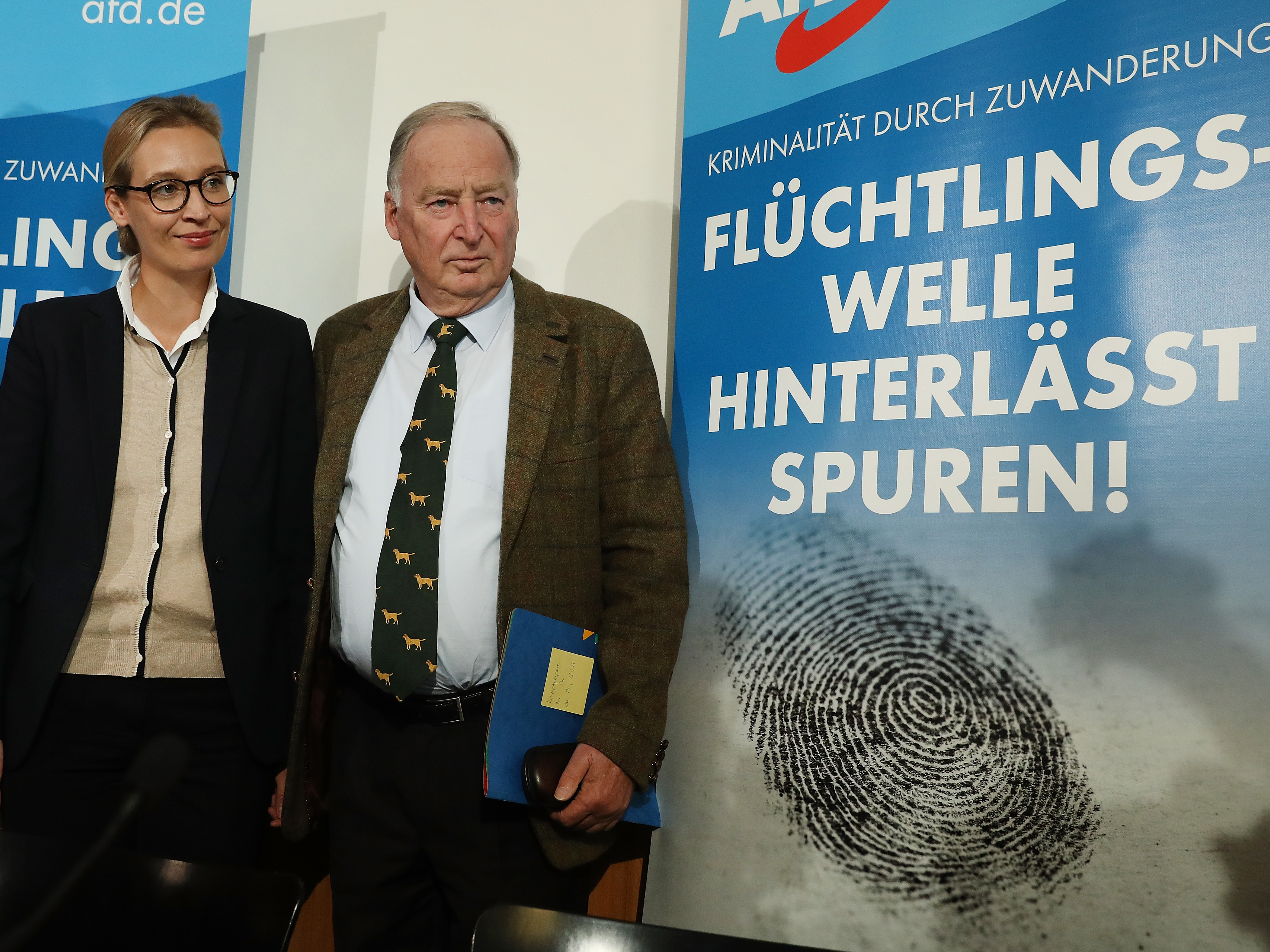 Alice Weidel and Alexander Gauland, leading candidates of the right-wing, populist Alternative for Germany (AfD) political party, stand near an AfD poster that reads: &quot;Crime Through Immigration, The Refugee Wave Leaves Behind Clues!&quot; Sept. 18 in Berlin. (Getty Images)
