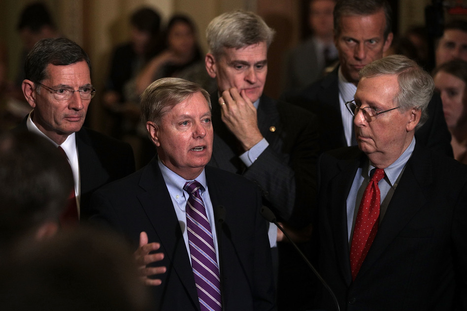 Sen. Lindsey Graham, second from left, speaks as Sen. John Barrasso, from left, Sen. Bill Cassidy, Sen. John Thune and Senate Majority Leader Sen. Mitch McConnell listen during a news briefing Tuesday. (Alex Wong/Getty Images)