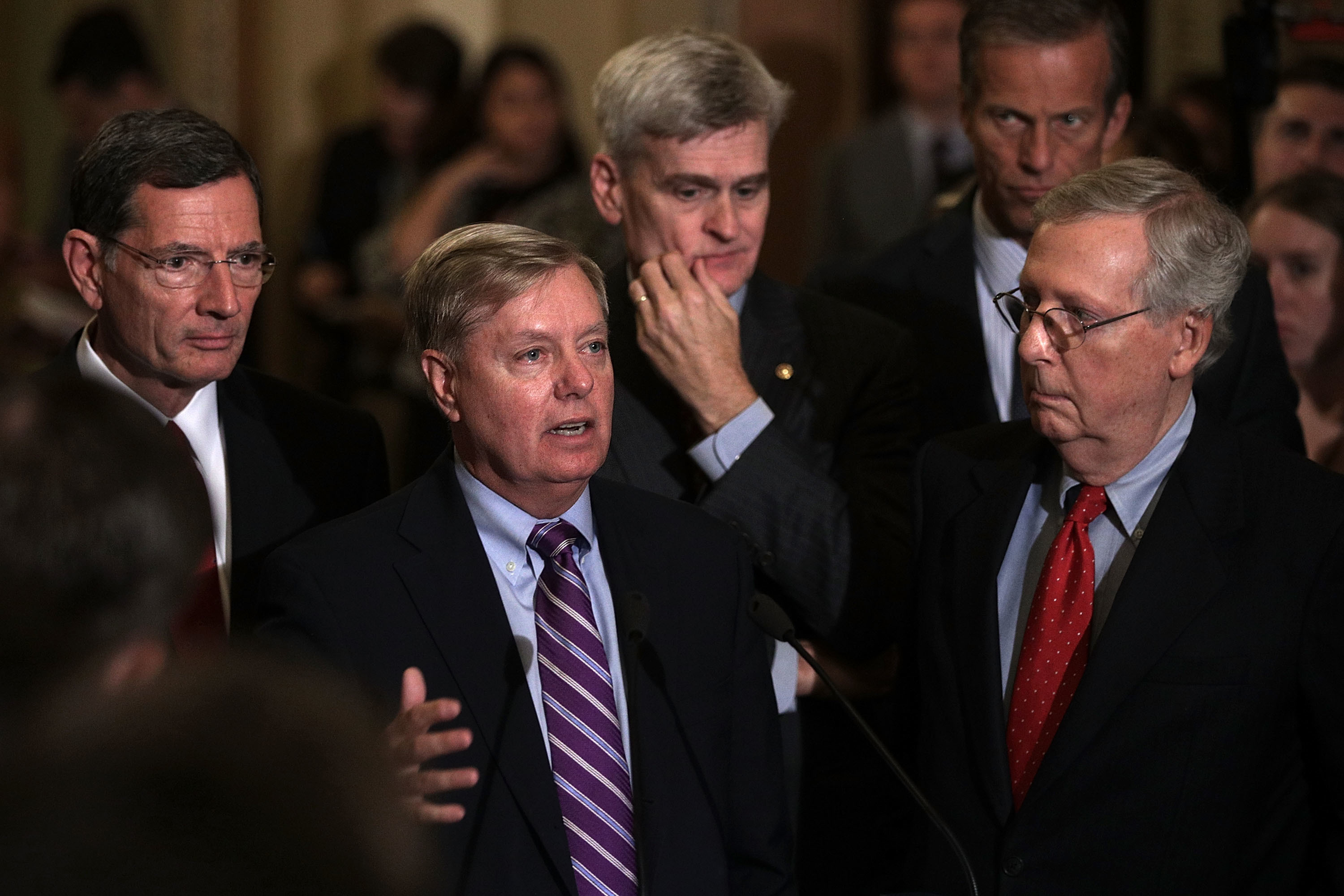 Sen. Lindsey Graham, second from left, speaks as Sen. John Barrasso, from left, Sen. Bill Cassidy, Sen. John Thune and Senate Majority Leader Sen. Mitch McConnell listen during a news briefing Tuesday. (Getty Images)