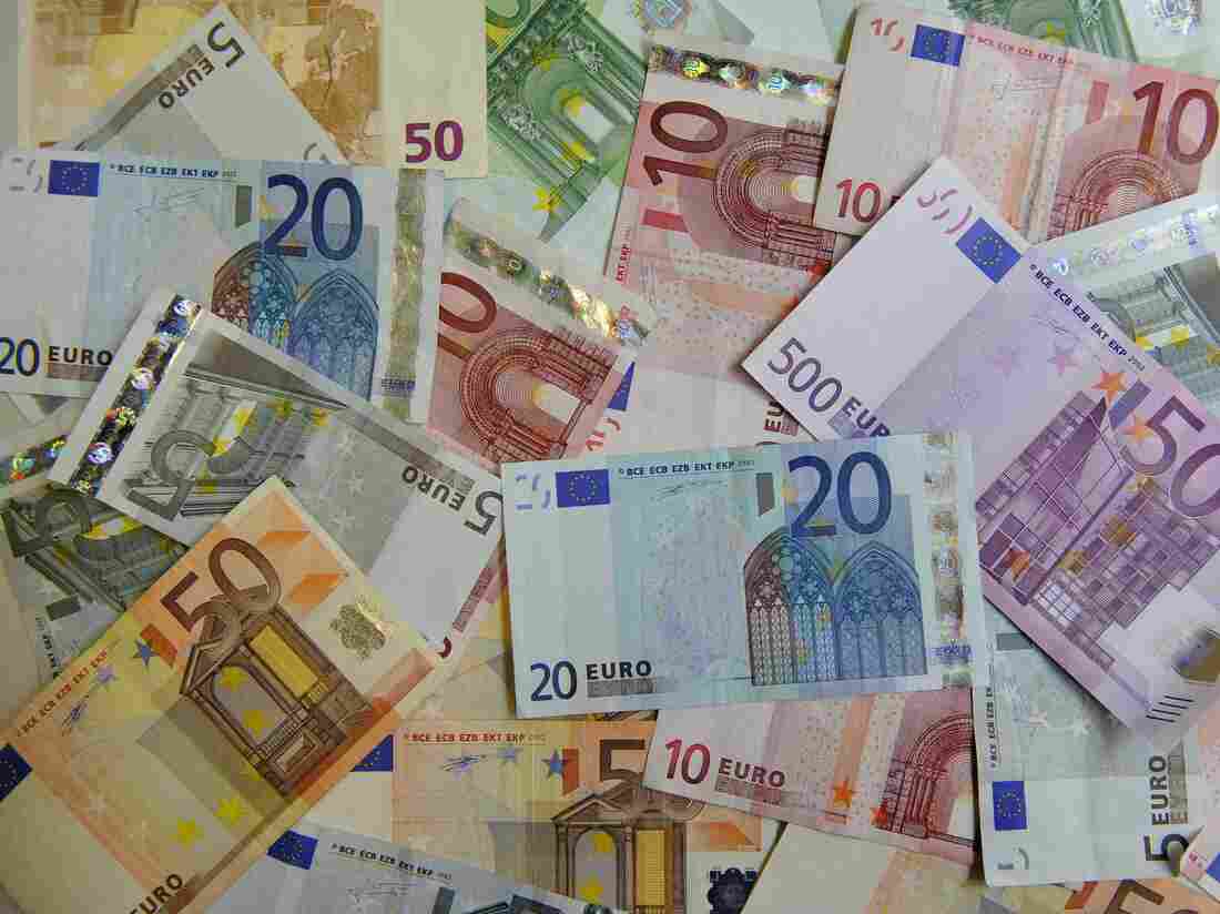Euro bank notes lie on a table in counter of a bank in Dresden, Germany, Monday, June 22, 2009. (AP Photo/Matthias Rietschel)