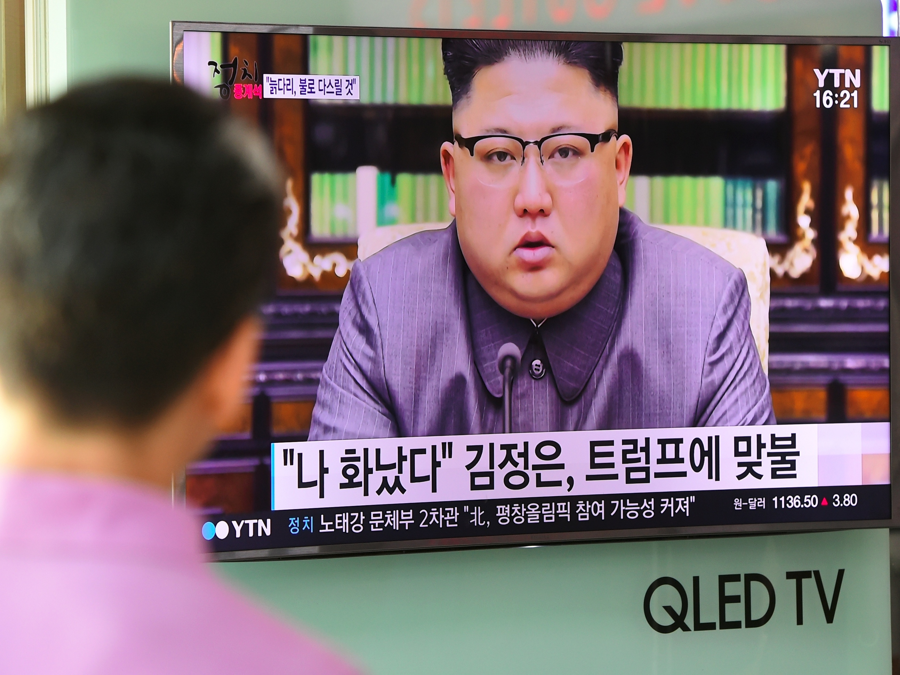A man at a railway station in Seoul watches as North Korean leader Kim Jong Un delivering a statement in Pyongyang. (AFP/Getty Images)