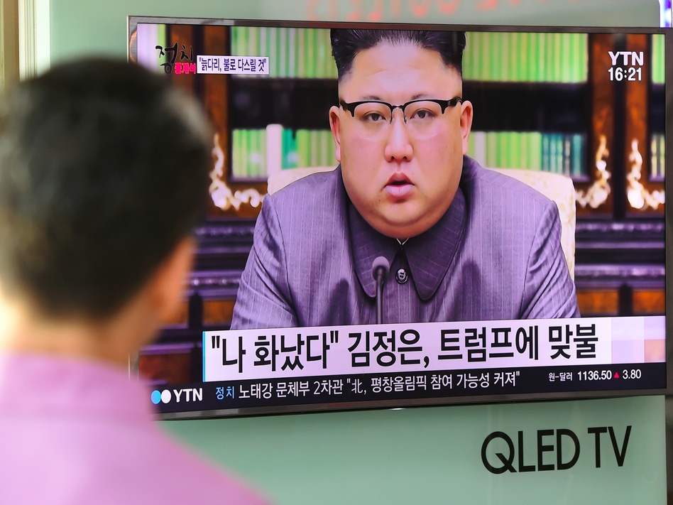 A man at a railway station in Seoul watches as North Korean leader Kim Jong Un delivering a statement in Pyongyang. (Jung Yeon-je/AFP/Getty Images)