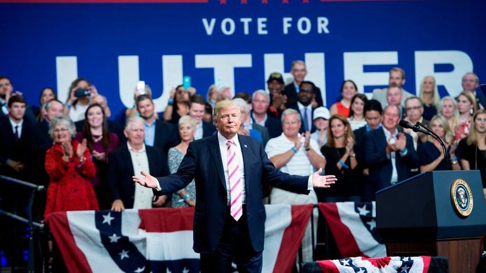 President Trump gestures while speaking during rally for Sen. Luther Strange, R-Ala., in Huntsville, Ala., on Friday. (Brendan Smialowski/AFP/Getty Images)