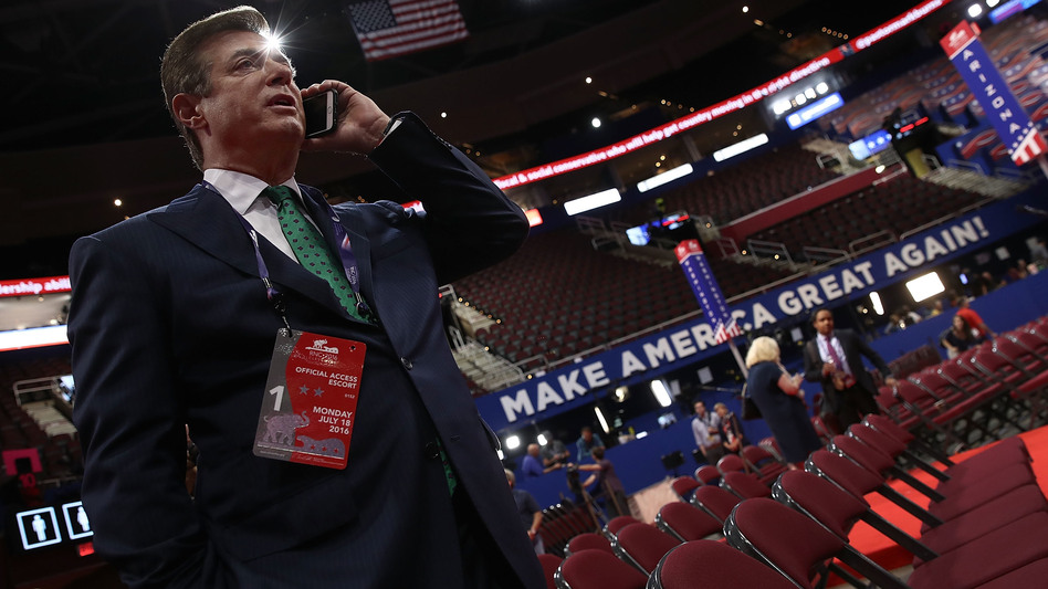 Paul Manafort speaks on the phone while touring the floor of the Republican National Convention on July 17, 2016, in Cleveland, Ohio. (Win McNamee/Getty Images)