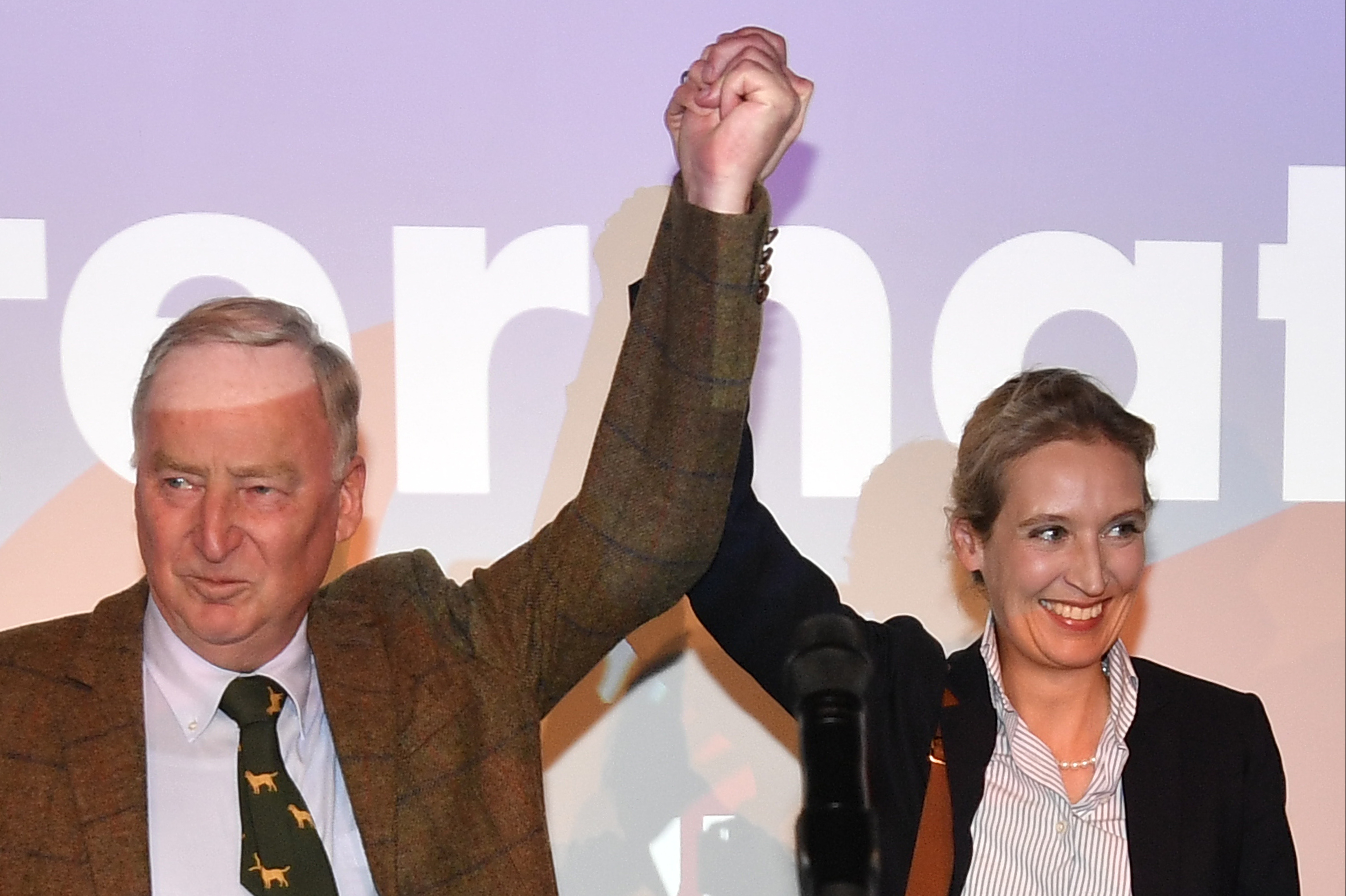 AfD top candidates Alexander Gauland, left, and Alice Weidel celebrate with their supporters during the election party of the nationalist Alternative for Germany, in Berlin, Sunday, after the polling stations for the parliament elections closed.
