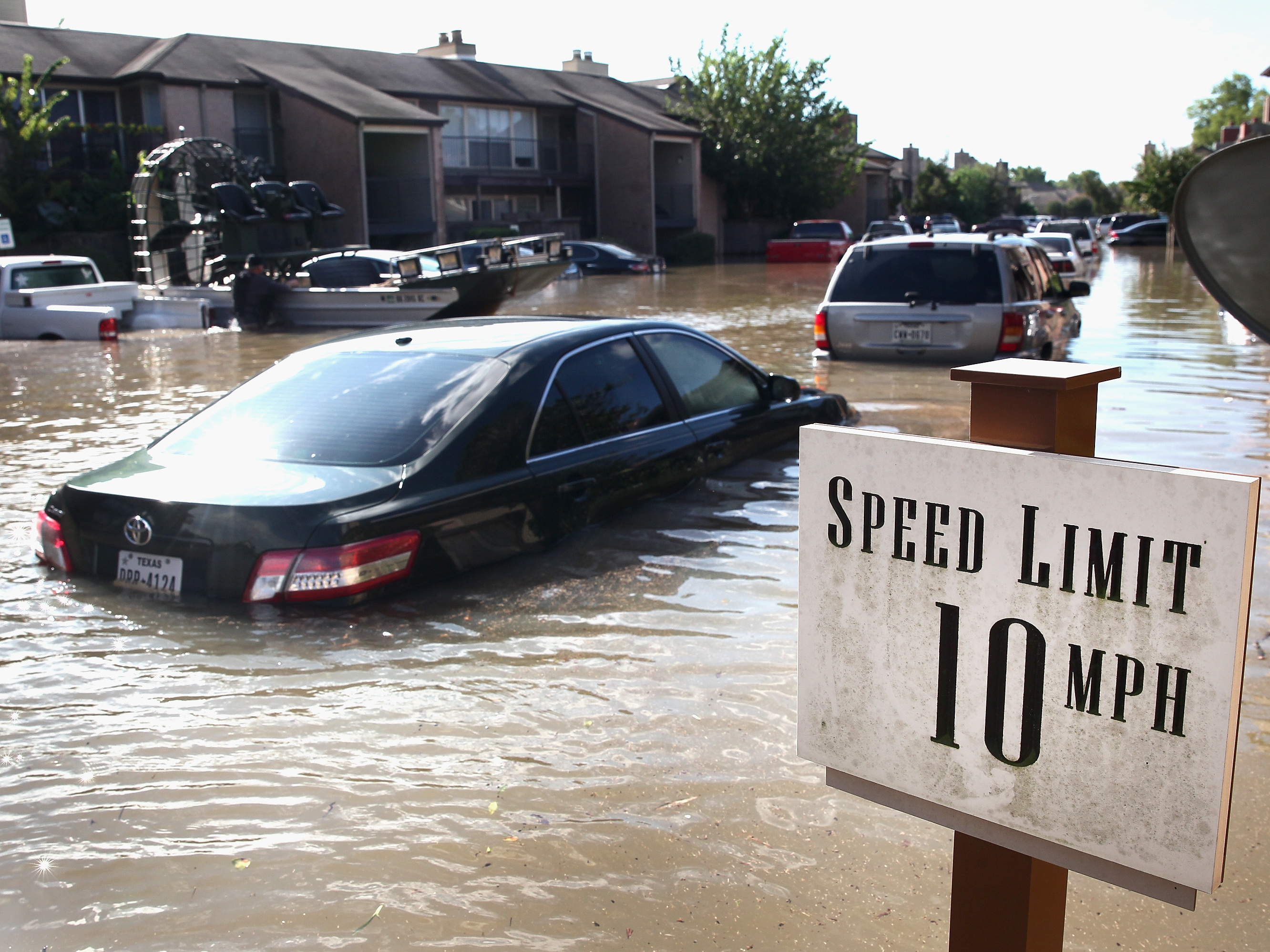 Cars sit along the street in Houston following Hurricane Harvey on Aug. 30. Car rental companies made preparations to move vehicles into affected areas even before the storm hit. (Getty Images)