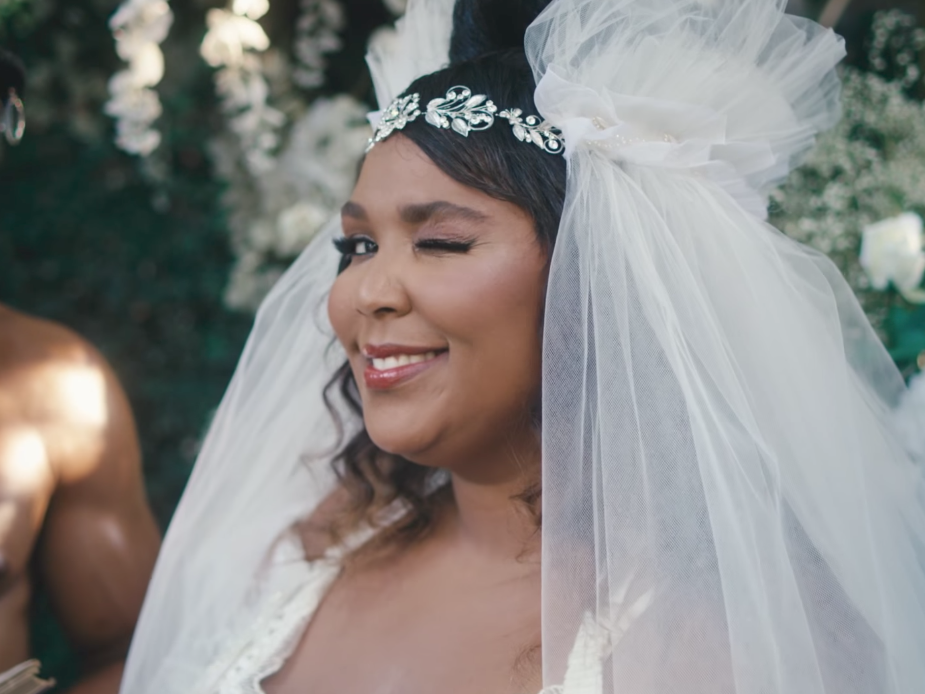 Lizzo, dressed in a bridal dress, in a scene from her new video for the song &quot;Truth Hurts.&quot; (YouTube screen shot)