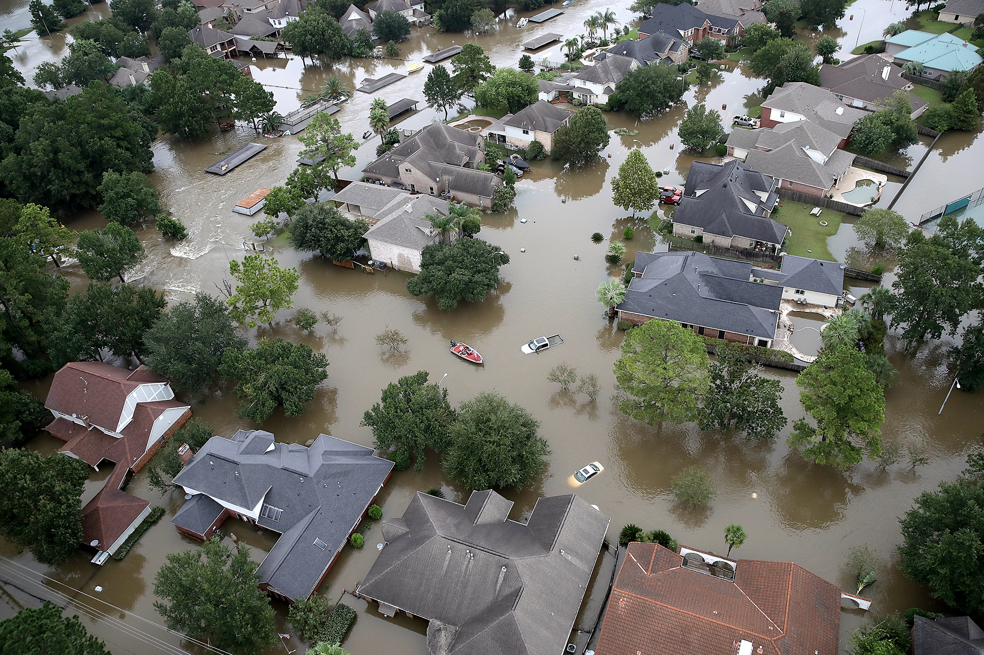 Flooded houses near Lake Houston on Aug. 30, after the storm called Harvey swept through. Sociologist Clare Cooper Marcus says our homes hold our emotional history — our memories, our hopes, our dreams and pain. In some ways our homes are who we are. (Getty Images)