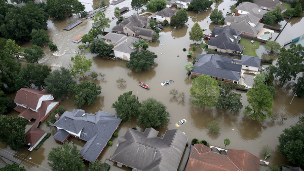 Flooded houses near Lake Houston on Aug. 30, after the storm called Harvey swept through. Sociologist Clare Cooper Marcus says our homes hold our emotional history — our memories, our hopes, our dreams and pain. In some ways our homes are who we are.
