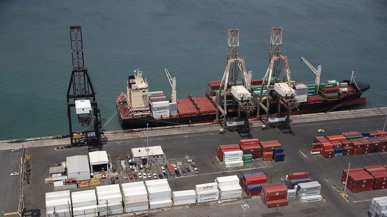 A container ship is seen docked at the port of San Juan as people deal with the aftermath of Hurricane Maria on Monday in San Juan, Puerto Rico. (Joe Raedle/Getty Images)