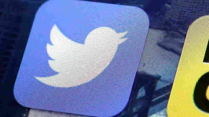 The Twitter app appears on an iPhone screen.