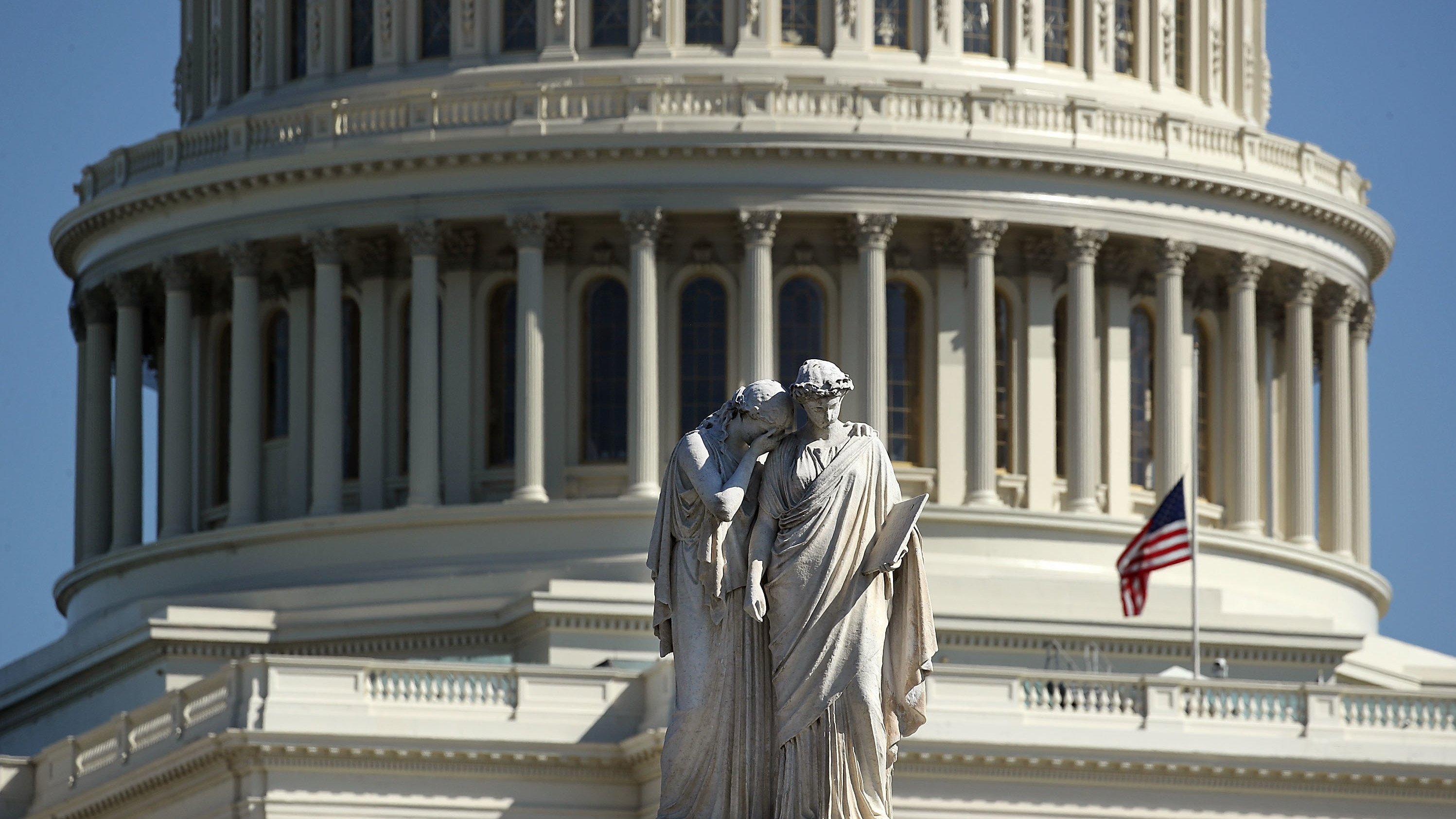 The Peace Monument stands in front of the U.S. Capitol where an American flag flies at half-staff following a mass shooting in Las Vegas late Sunday that killed over 50 people. (Getty Images)