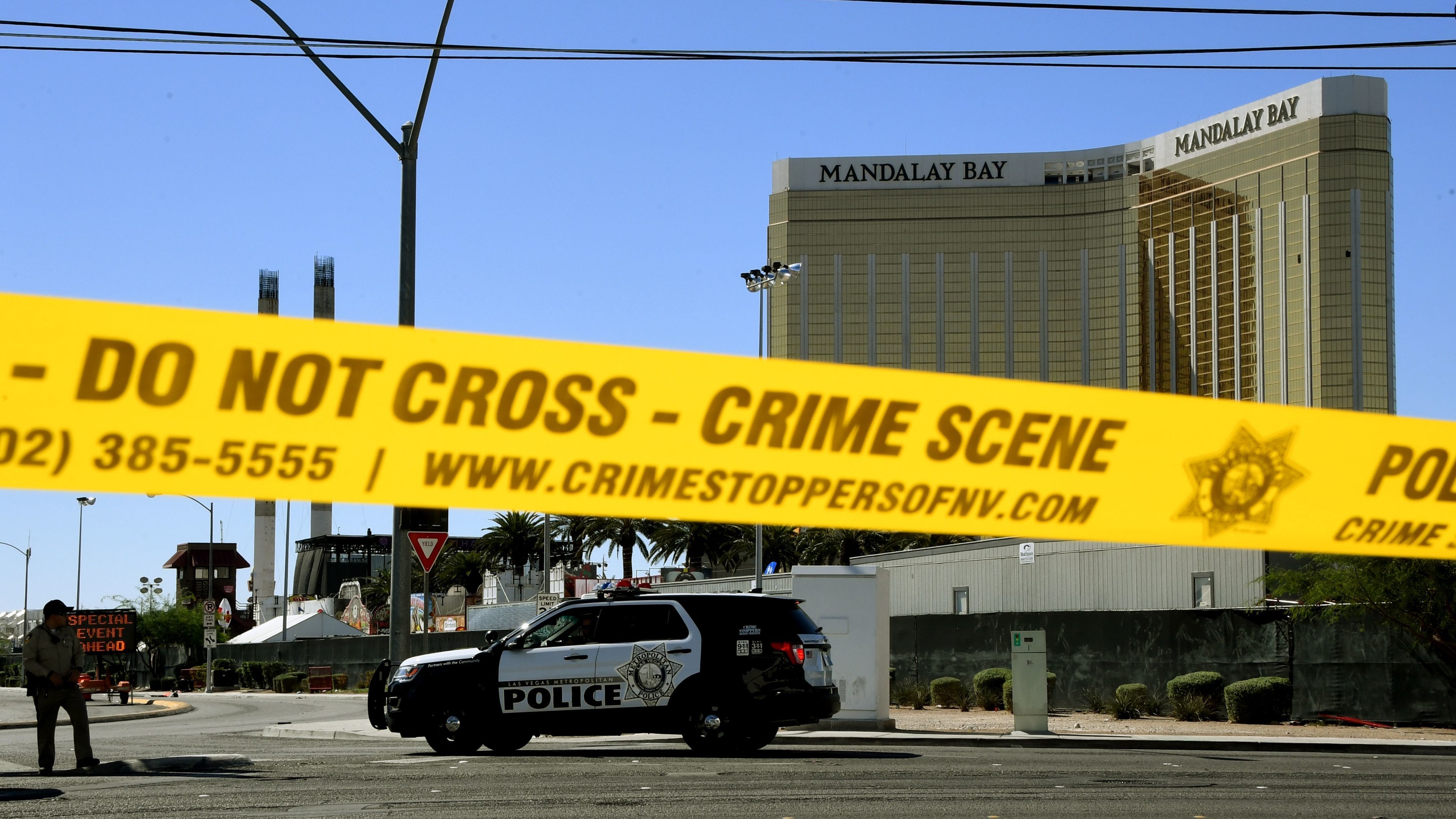 Crime scene tape surrounds the Mandalay Hotel in Las Vegas after a gunman in one of its rooms killed at least 58 people, with more than 500 others injured, when he opened fire on a country music concert late Sunday. (AFP/Getty Images)