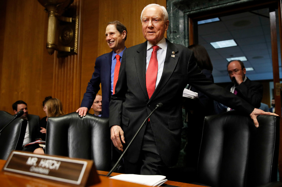 Senate Finance Committee Chairman Orrin Hatch, R-Utah, center, and ranking member Ron Wyden, D-Ore., have a plan to renew funding for the Children's Health Insurance Program, which lapsed Sept. 30. (Jacquelyn Martin/AP)