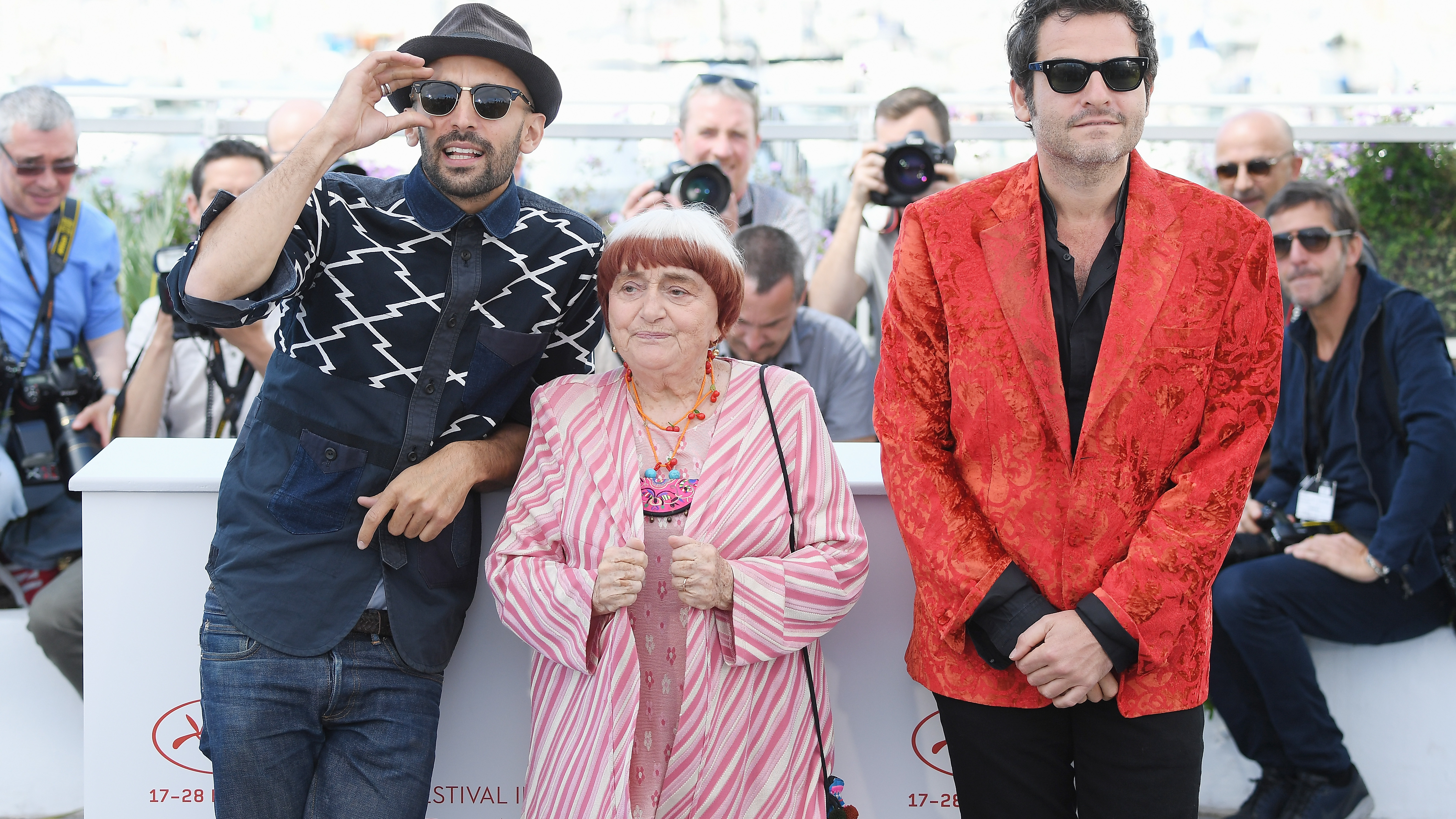 <em>Faces Places</em> co-directors JR and Agnes Varda (along with composer Matthieu Chedid, right) at this year's Cannes film festival. (WireImage)