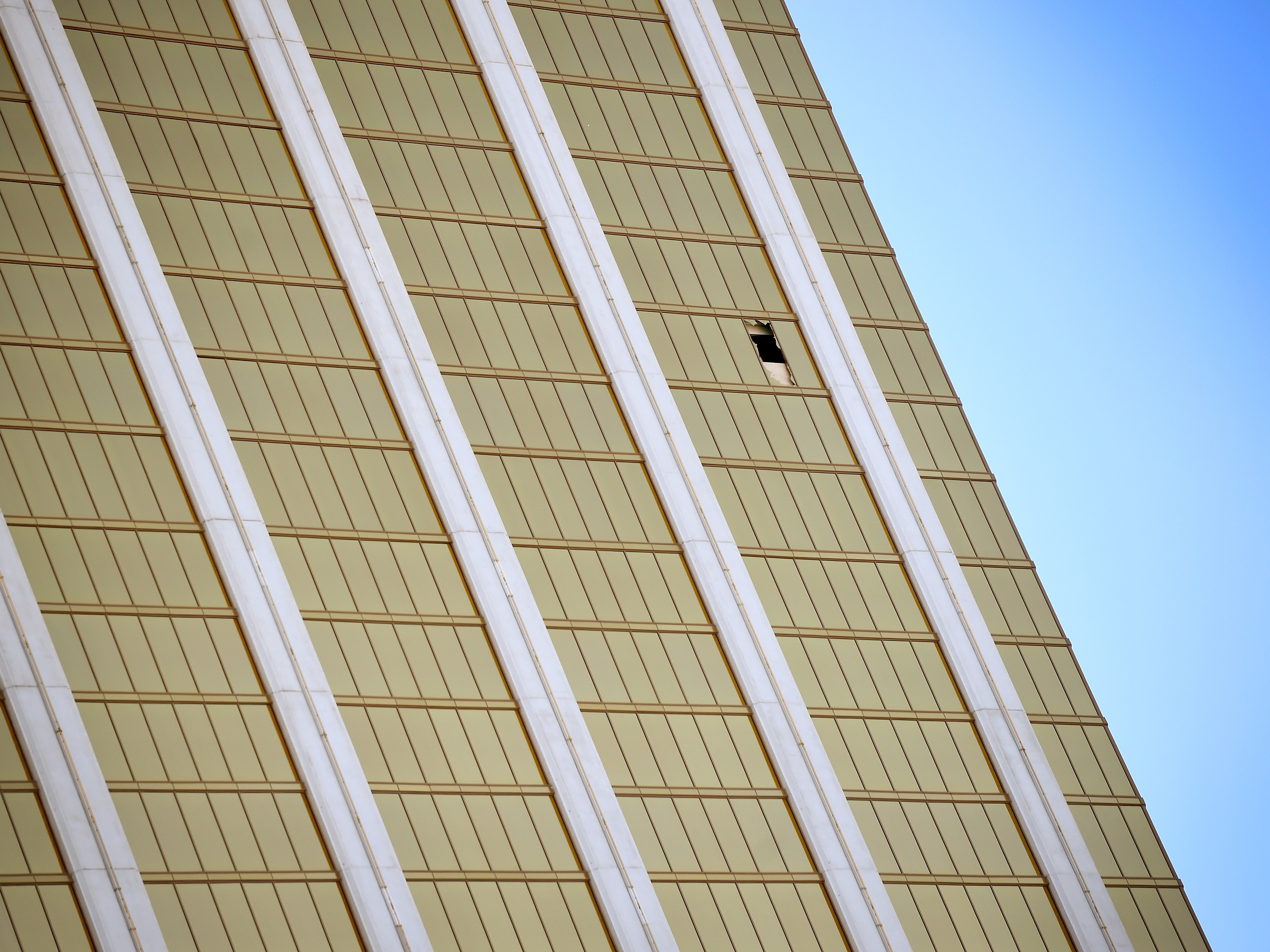 A broken window is seen at the Mandalay Bay Resort & Casino on Wednesday along the Las Vegas Strip. Investigators still don't understand why the shooter carried out his rampage. (Getty Images)