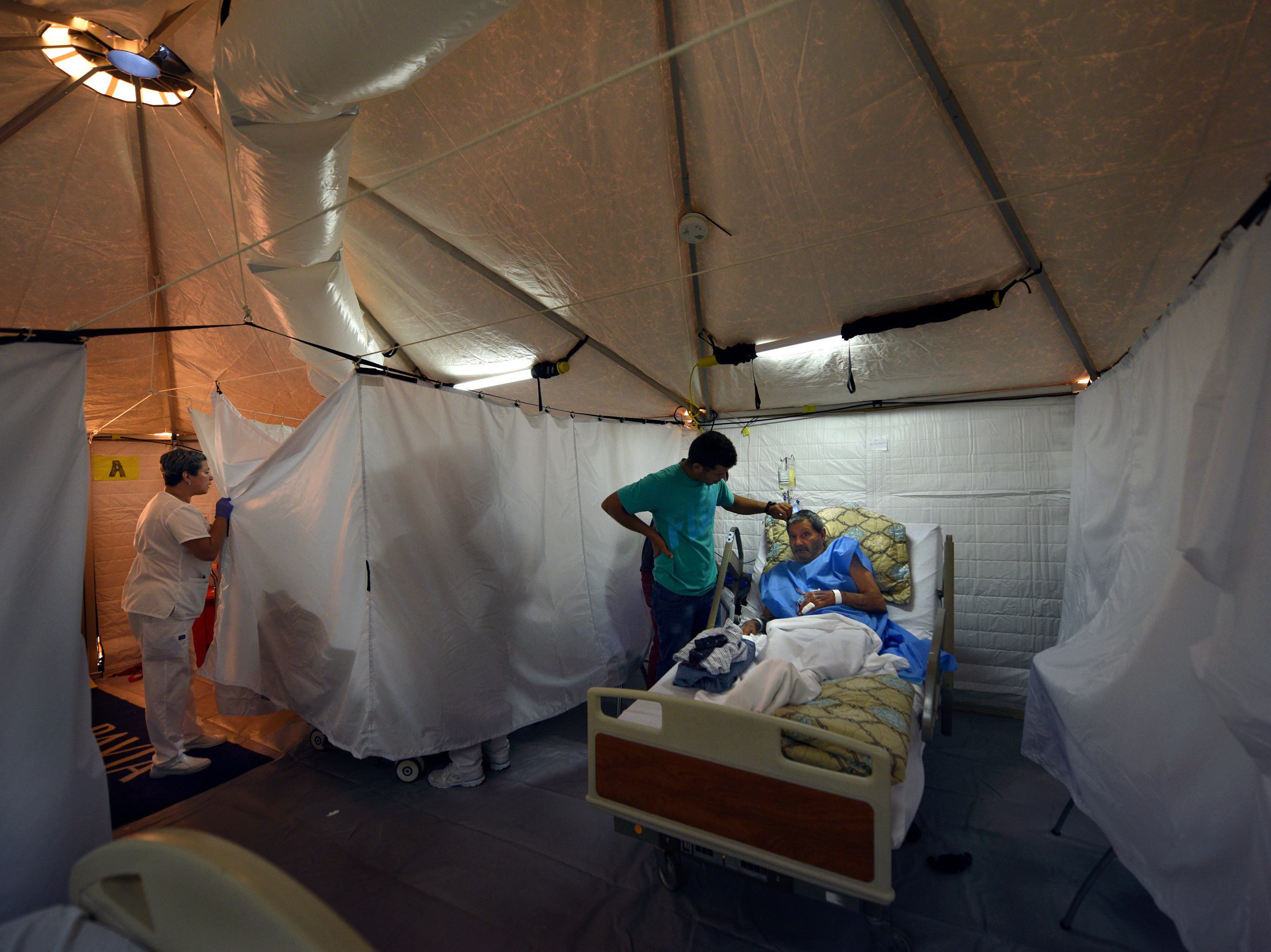 The hospital in Arecibo, Puerto Rico, evacuated its coronary floor this week and moved those patients into cooled tents erected by an American disaster medical team. (Carol Guzy for NPR)