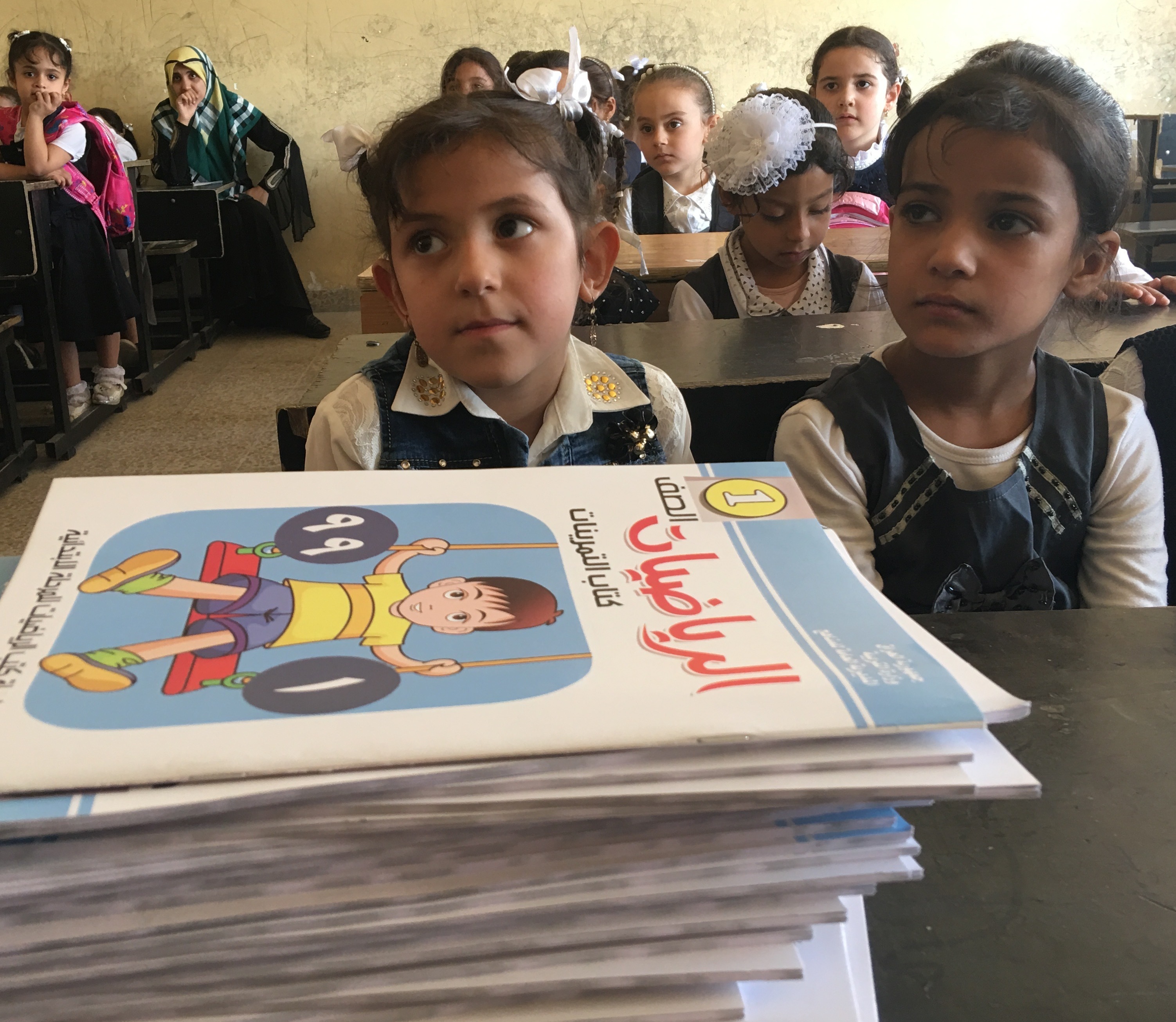 Iraqi children arrive at an elementary school in Mosul for the first regular school year in three years. Most parents pulled their children out of school when ISIS took over Mosul — and the school system — in 2014. Students this year were allowed to take makeup classes and sit for exams to make up the years they missed.