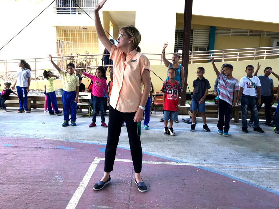 Nora Ortiz Navarro, the social worker at Escuela Gaspar Vilá Mayans, leads students in exercises to help them deal with stress and feel calm. (Lauren Migaki/NPR)