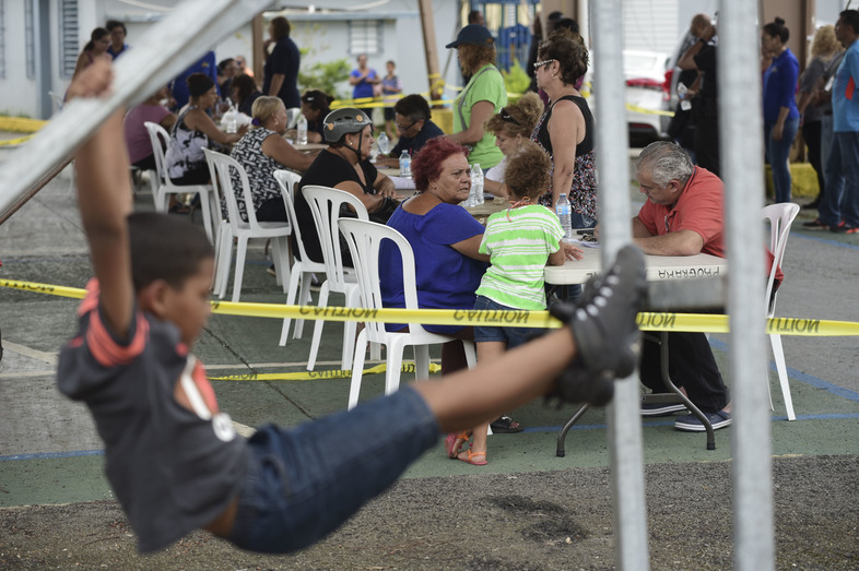 In the aftermath of Hurricane Maria, residents meet with FEMA representatives to file forms for federal aid at the Jose de Diego Elementary School in Las Piedras, Puerto Rico, on Oct. 2. (Carlos Giusti/AP)