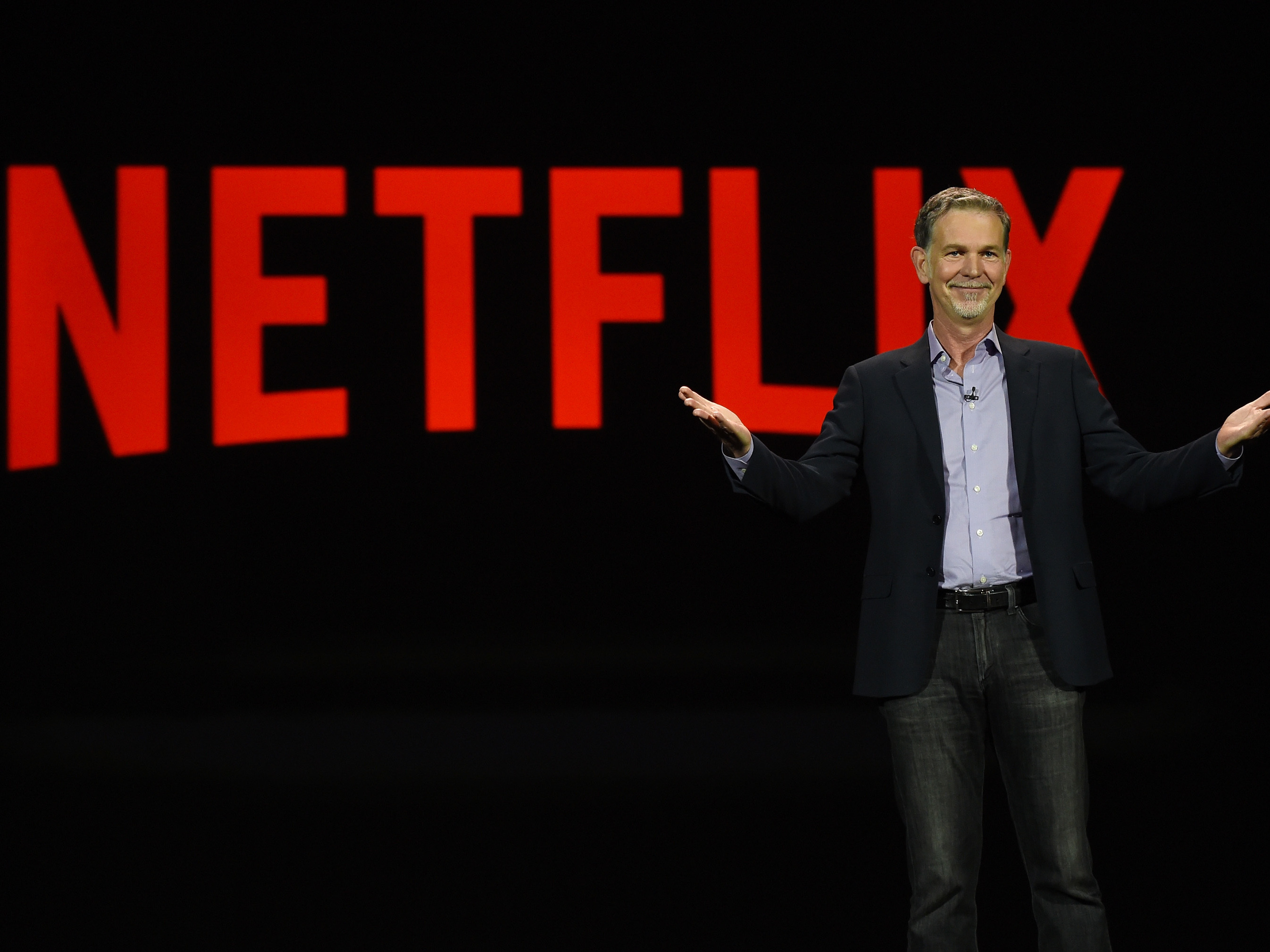 Netflix CEO Reed Hastings delivers a keynote address at CES 2016 in Las Vegas. He has admitted facing Amazon in video is a challenge. (Getty Images)