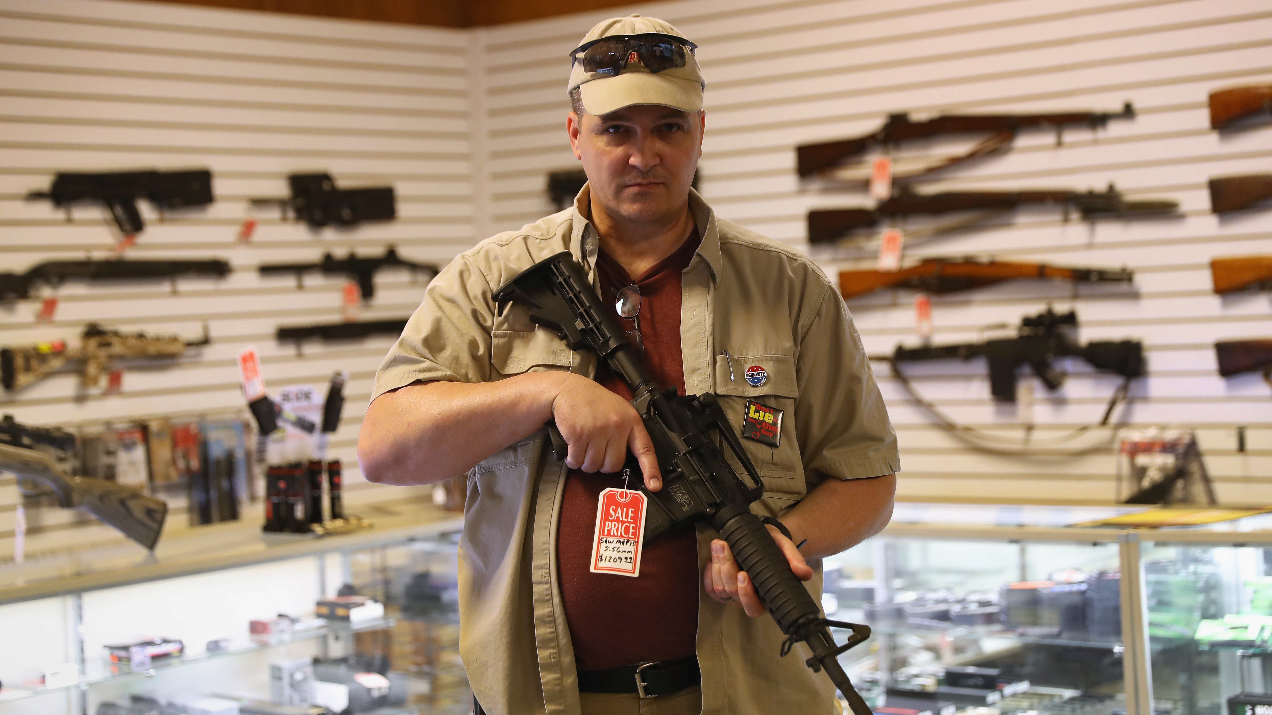 Shop owner Jeff Binkley displays an AR-15 &quot;Sport&quot; rifle at Sarge's Sidearms on Sept. 29, 2016 near Benson, Ariz. (Getty Images)