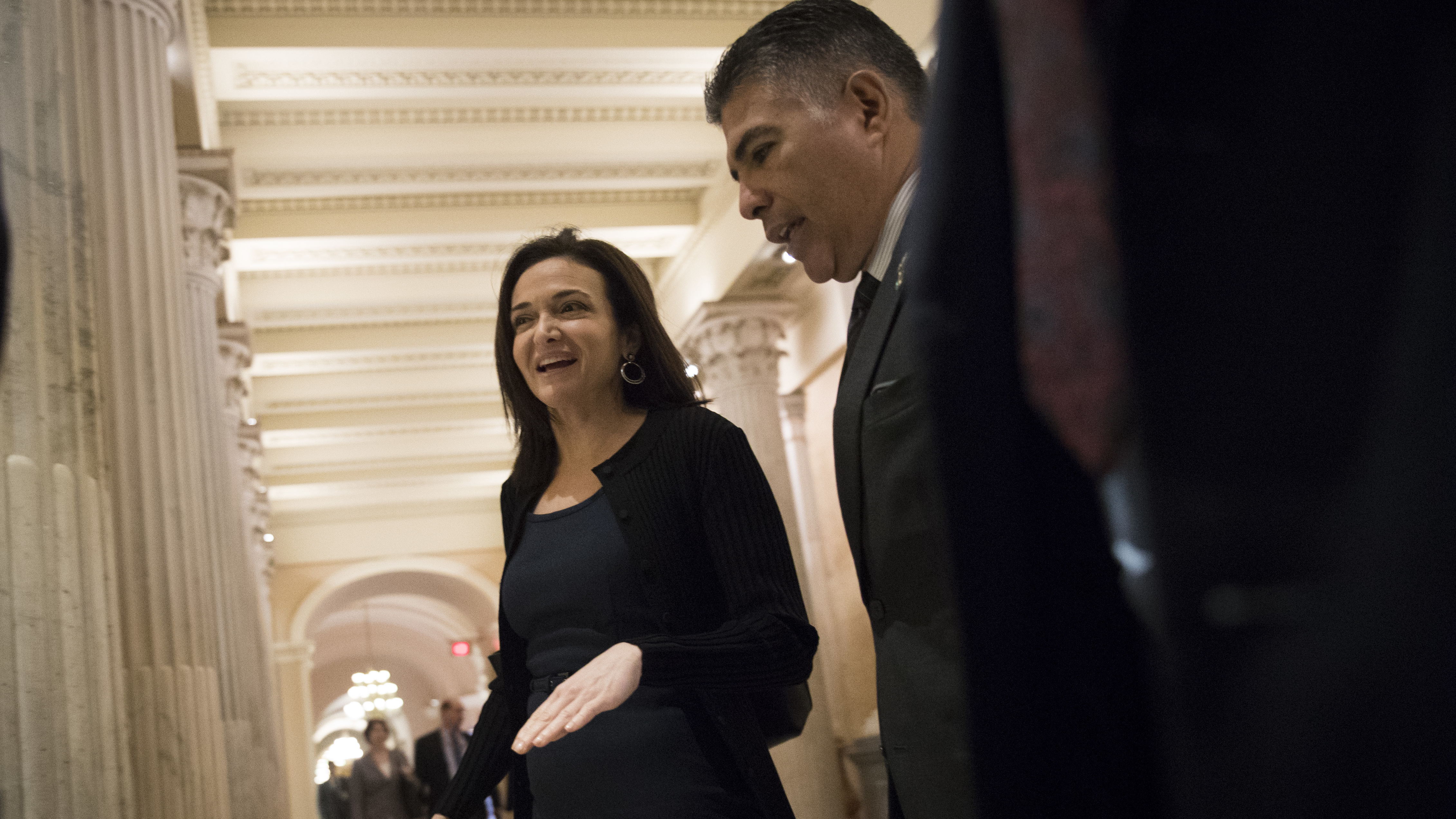Sheryl Sandberg, chief operating officer of Facebook, walks with Rep. Tony Cardenas, D-Calif., on their way to a meeting with members of the Congressional Black Caucus, at the Capitol, on October 12, 2017, in Washington, DC. (Getty Images)