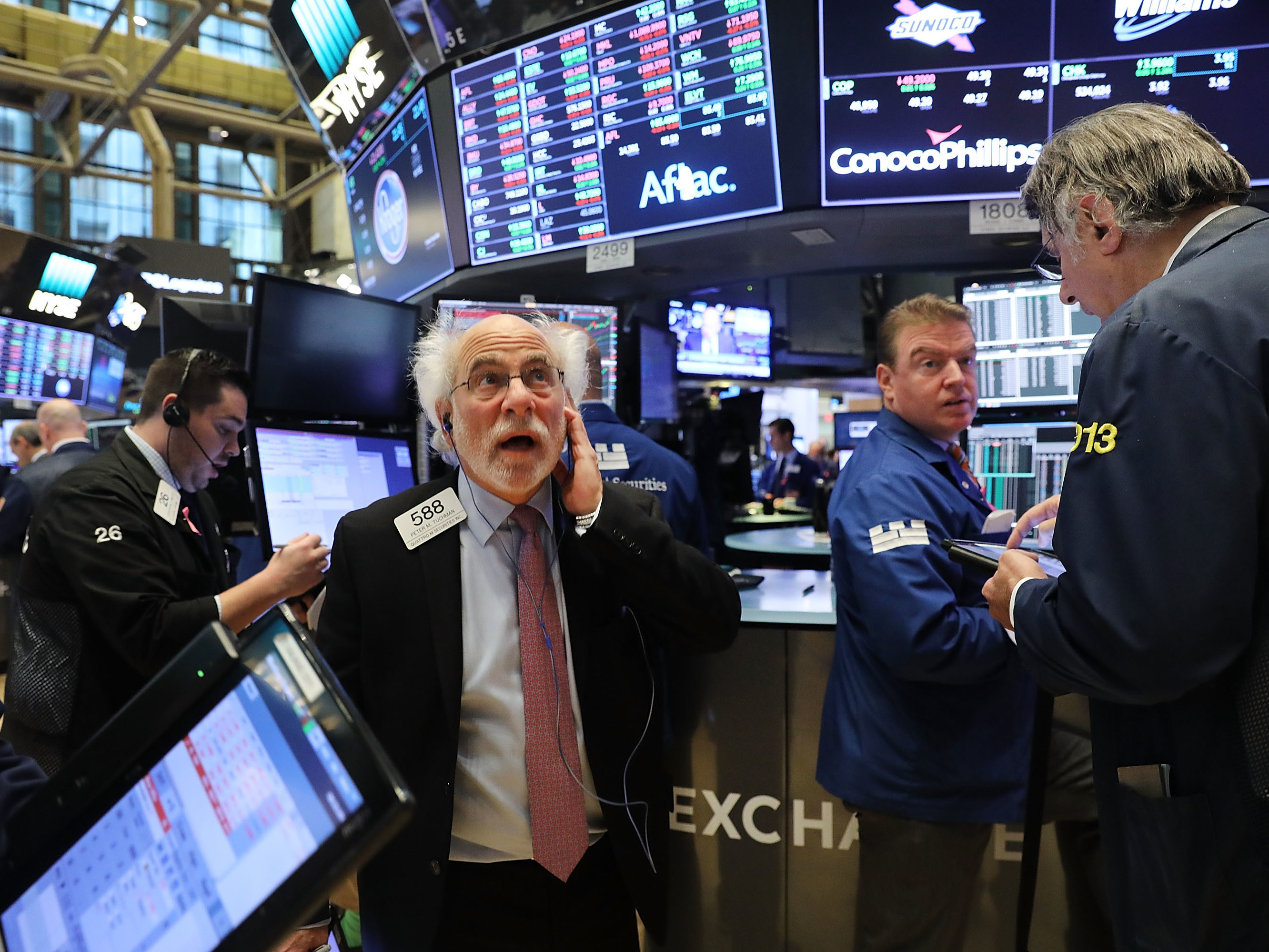 Dow crosses another milestone, topping 23,000 for the first time