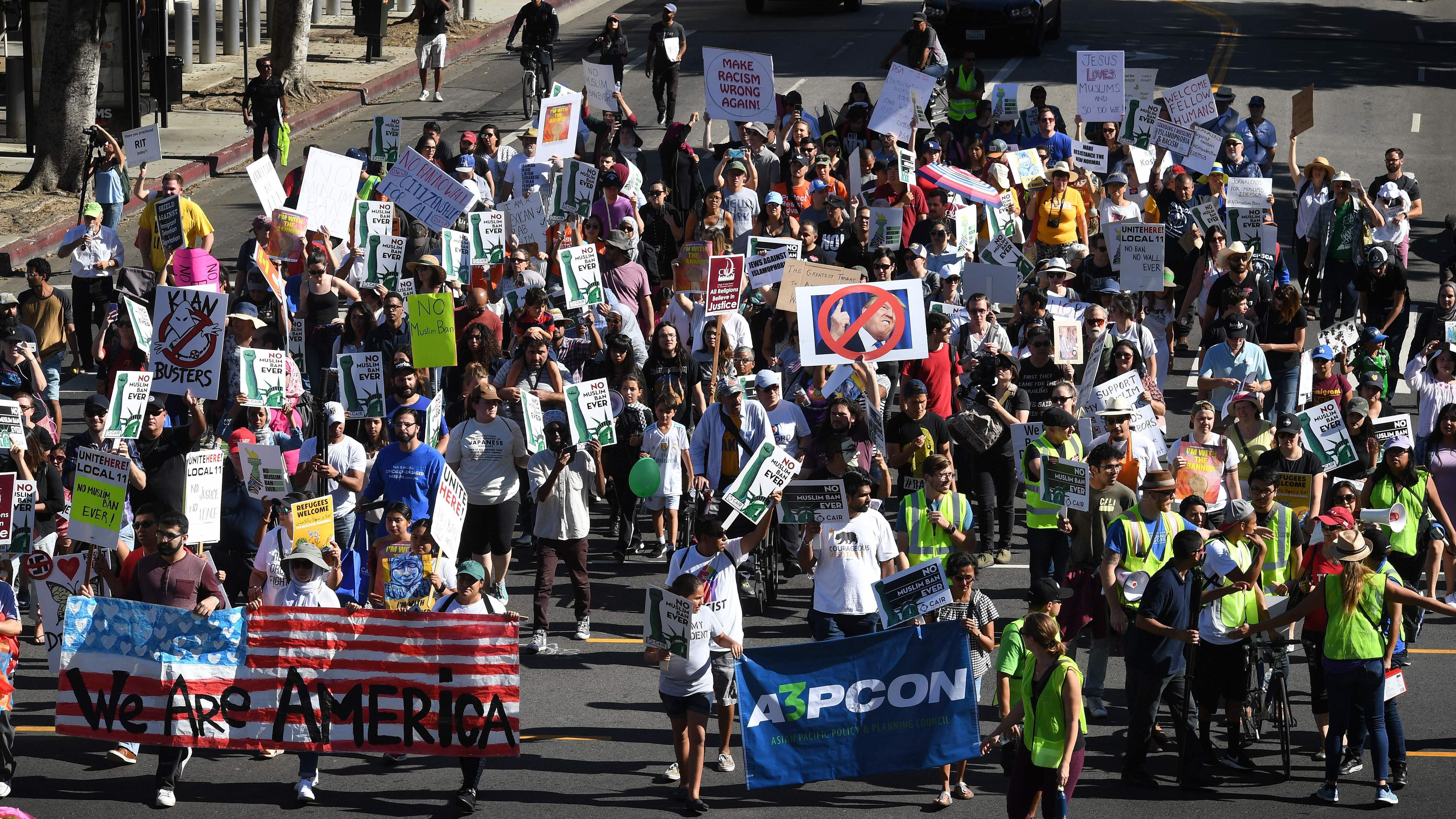 People marching in the &quot;#NoMuslimBanEver&quot; rally in downtown Los Angeles on Sunday. Organized by the Council on American-Islamic Relations, the march was in response to President Trump's most recent travel ban, which has now been partially blocked by a federal judge in Hawaii. (AFP/Getty Images)