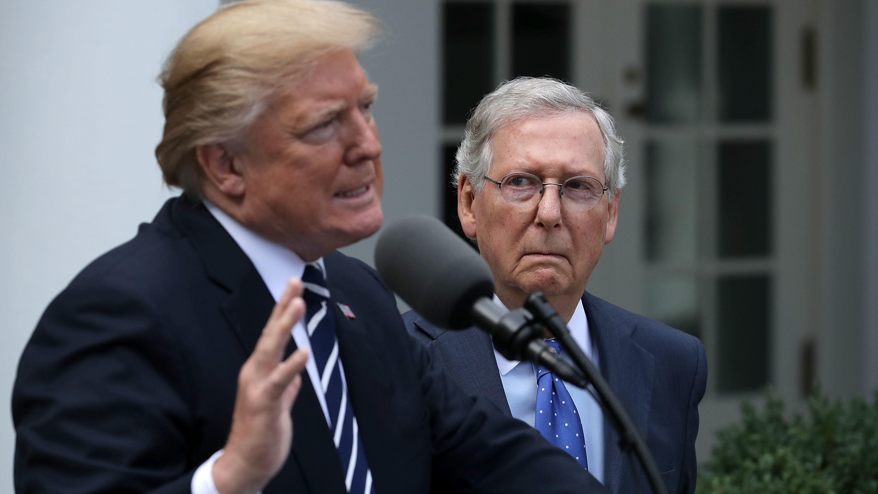 Senate Majority Leader Mitch McConnell looks on as Preisdent Trump speaks to reporters in the White House Rose Garden following a lunch meeting. (Getty Images)