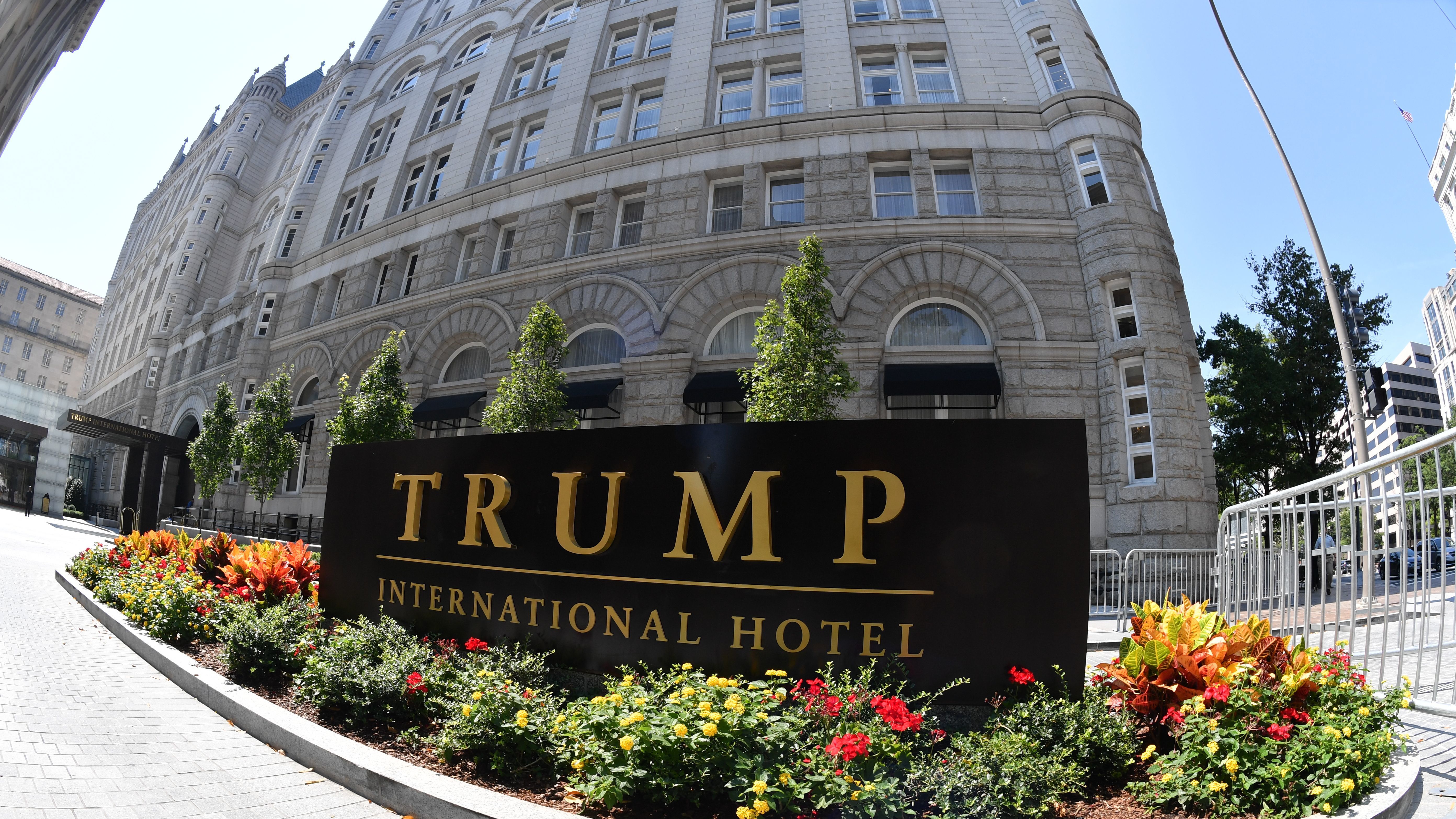 A lawsuit against President Trump alleges he is violating the Foreign and Domestic Emoluments clauses of the Constitution. Plaintiffs' lawyer Deepak Gupta says Trump's Washington hotel (above) is &quot;an emoluments magnet.&quot; (AFP/Getty Images)