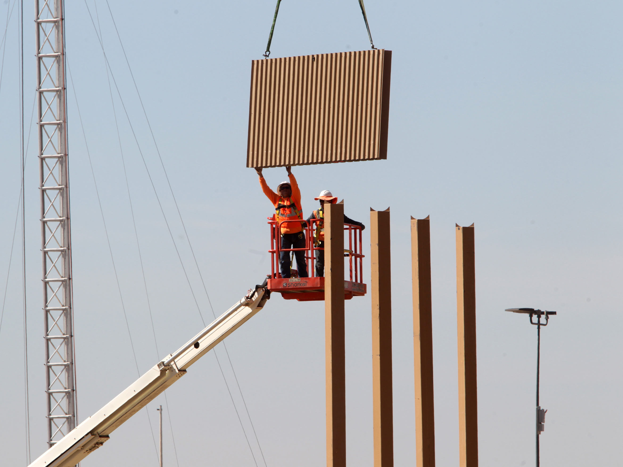 Border wall prototypes are being erected on Otay Mesa in San Diego County, just north of the U.S.-Mexico border.
