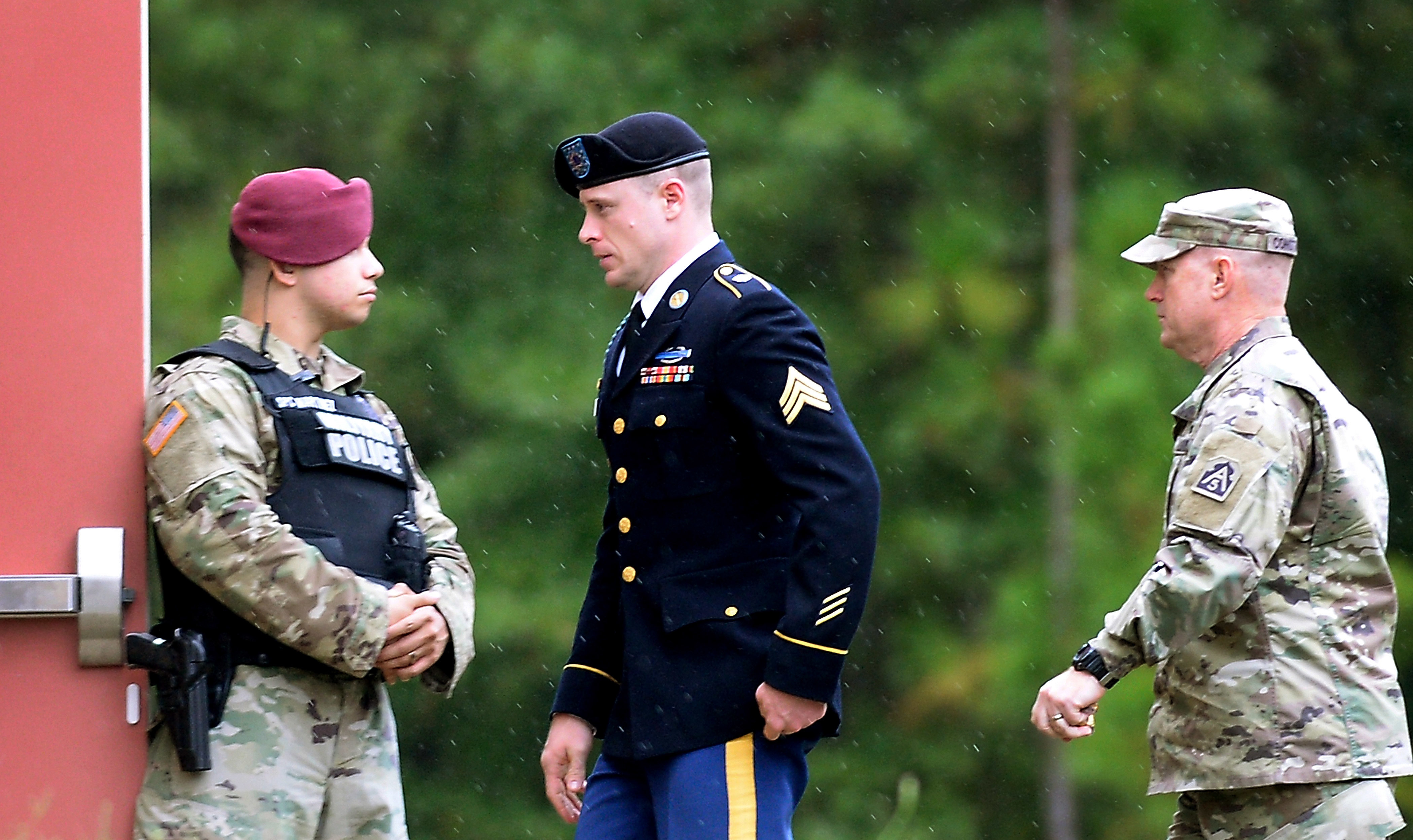 U.S. Army Sgt. Bowe Bergdahl (center) is escorted to the military courthouse at Fort Bragg, N.C., on Oct. 16, the day he pleaded guilty to desertion and misbehavior before the enemy.