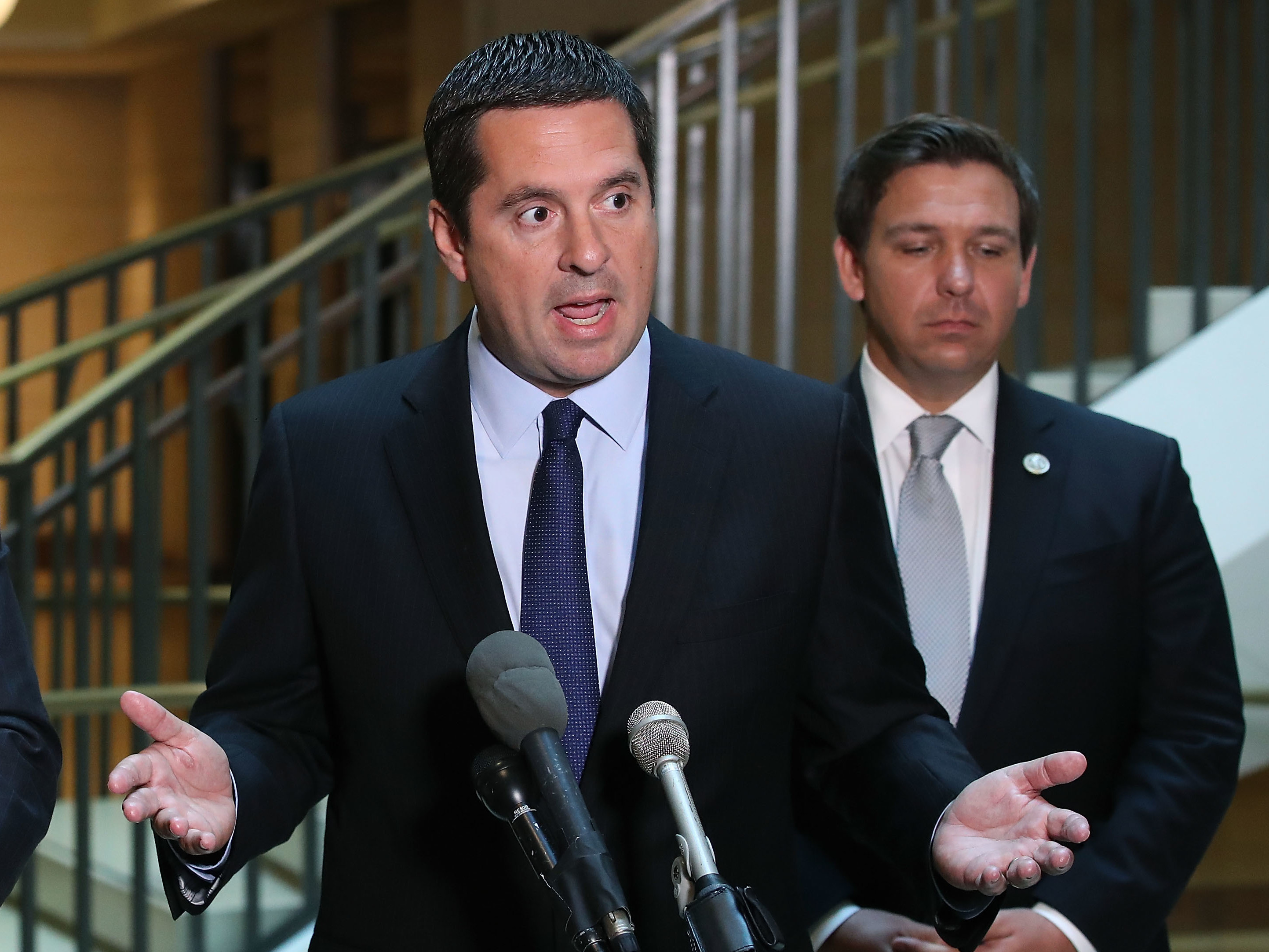 House Intelligence Committee Chairman Devin Nunes, R-Calif., speaks while flanked by and Rep. Don DeSantis, R-Fla., as he announces that his committee and the House oversight committee are starting an investigation into a 2010 deal between Russia and the Obama Administration. (Getty Images)