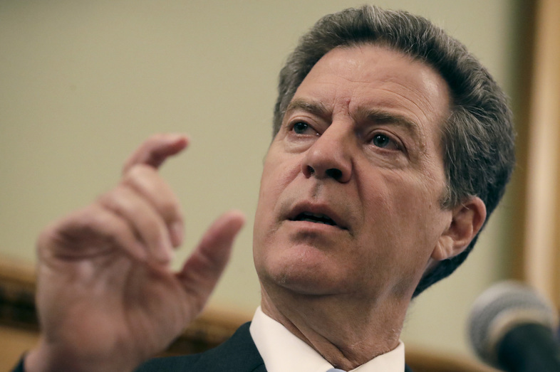 In 2012, Republican Gov. Sam Brownback of Kansas pushed reforms through the Legislature that included across-the-board income tax reductions. But rather than boosting the economy, the cuts caused revenues to plummet. Lawmakers now seek to close a $900 million budget gap over the next two years. (Charlie Riedel/AP)