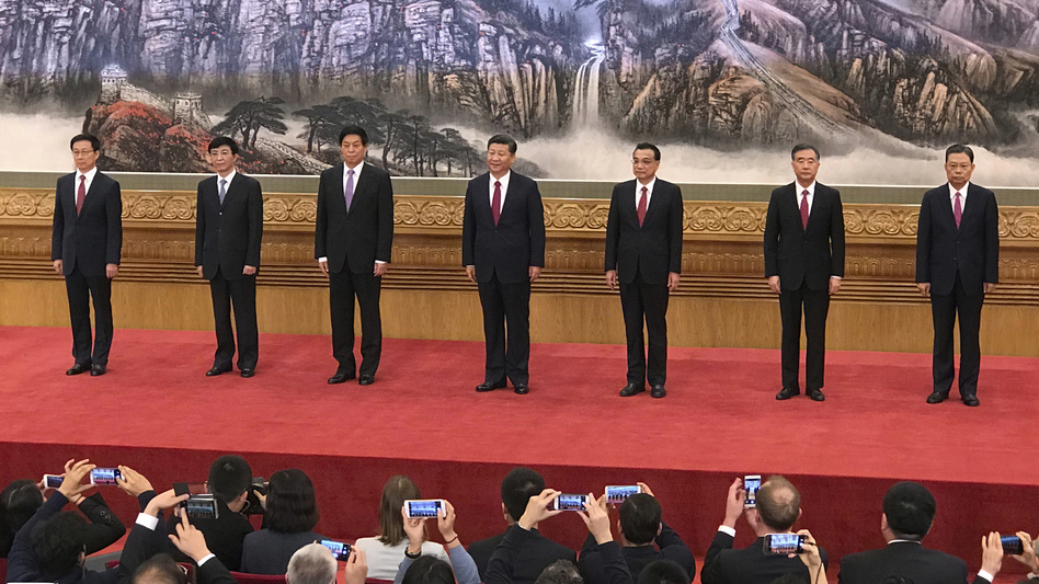 New members of the Politburo Standing Committee (from left) Han Zheng, Wang Huning, Li Zhanshu, Xi Jinping, Li Keqiang, Wang Yang and Zhao Leji stand together at Beijing's Great Hall of the People on Wednesday. (Ng Han Guan/AP)