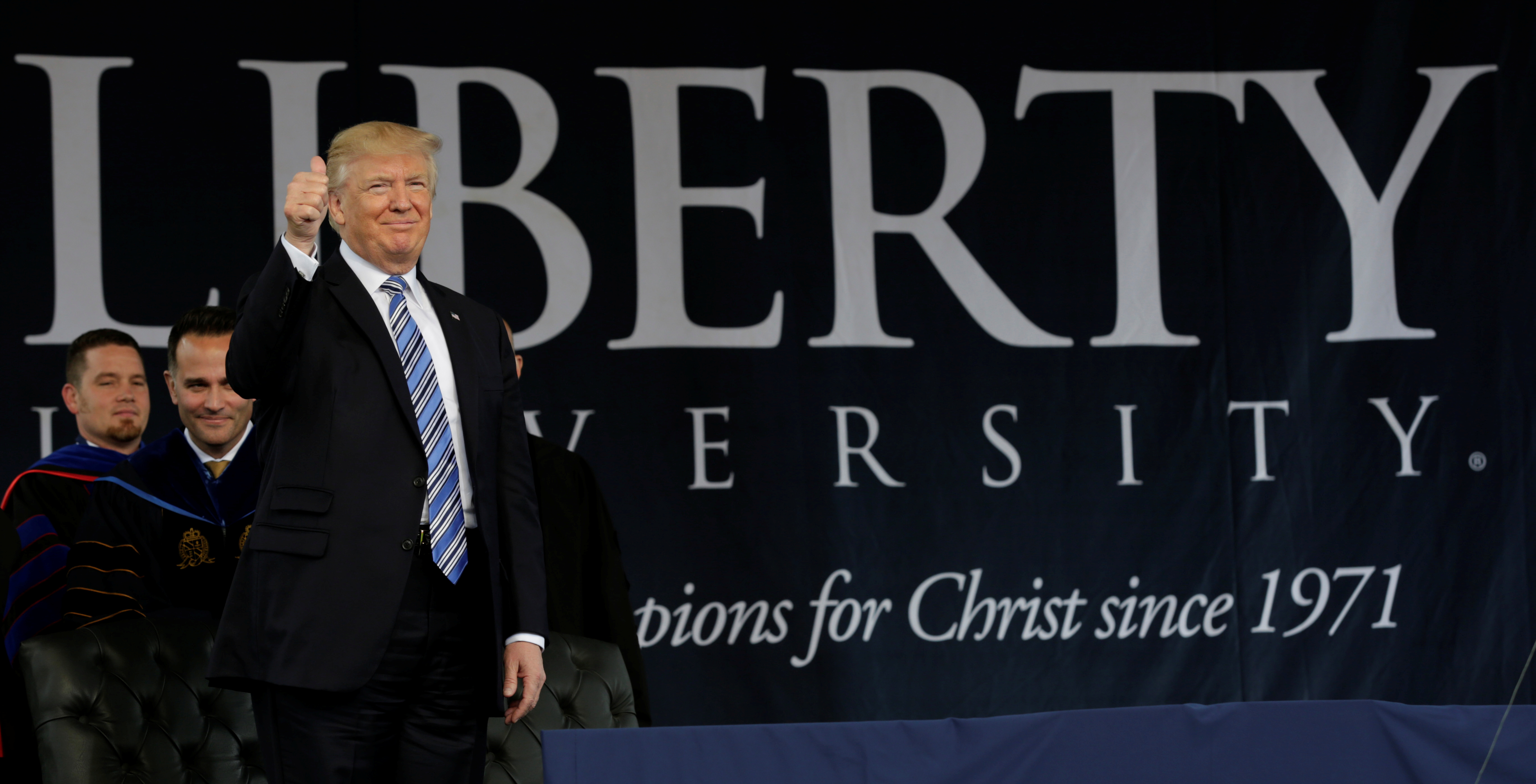 President Trump addresses the crowd before delivering the keynote address at Liberty University's commencement in Lynchburg, Va., on May 13. (Reuters)