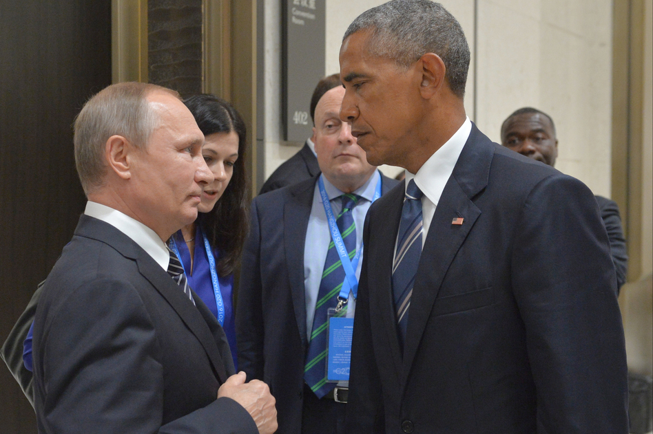Russian President Vladimir Putin, left, speaks with then-U.S. President Barack Obama in Hangzhou, China, on Sept. 5, 2016. (Alexei Druzhinin/AP)