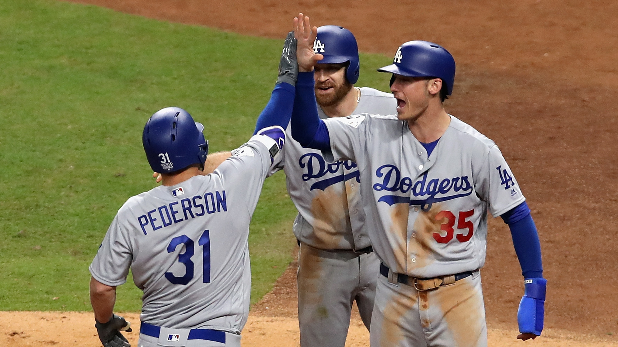 Joc Pederson of the Los Angeles Dodgers celebrates hitting a three-run home run in the ninth inning. (Getty Images)