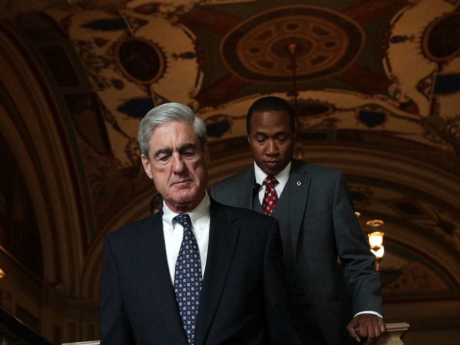 Special counsel Robert Mueller (left) arrives at the U.S. Capitol for closed meeting with members of the Senate Judiciary Committee on June 21 in Washington, D.C. (Alex Wong/Getty Images)