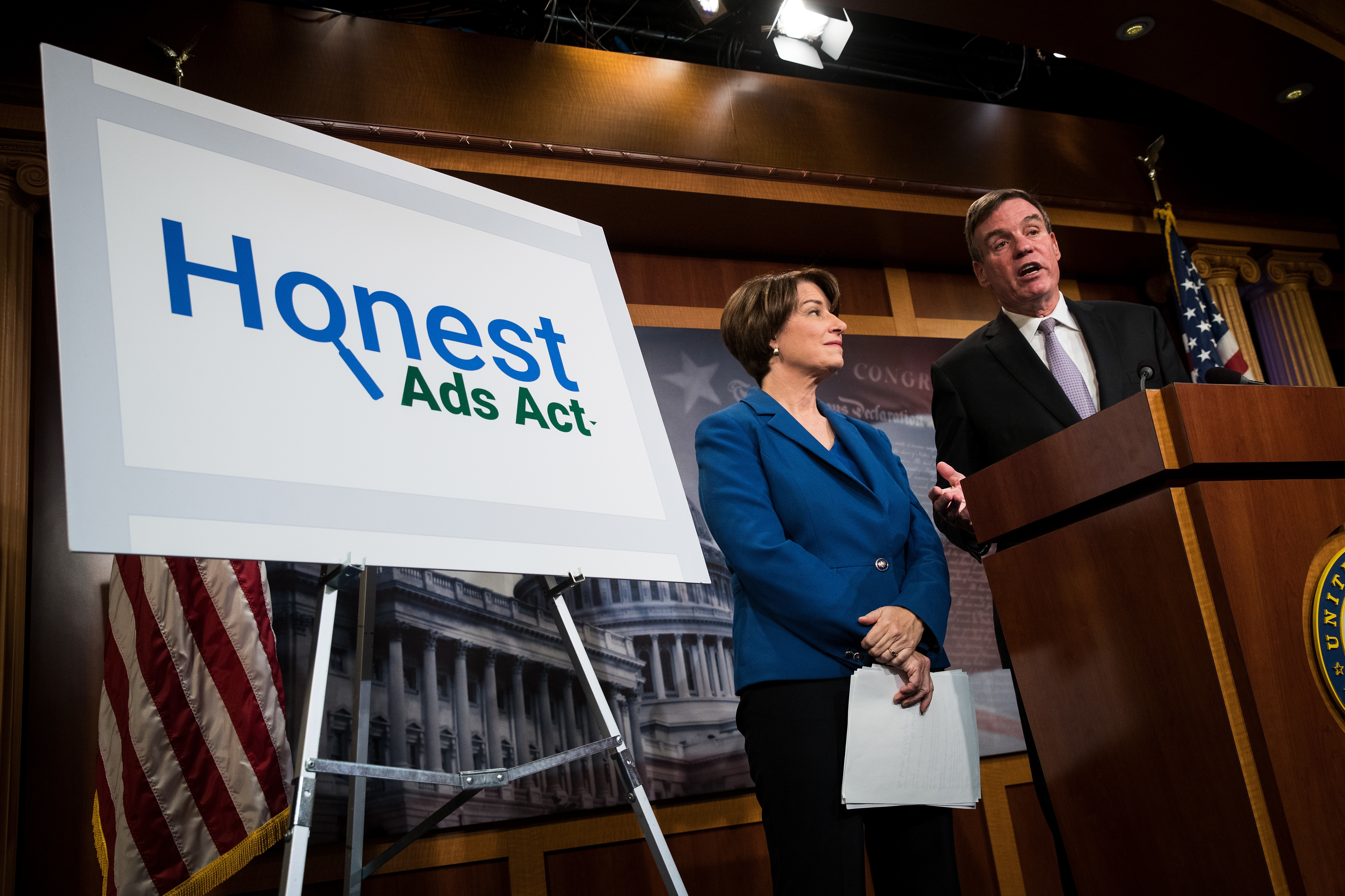 Sen. Amy Klobuchar, D-Minn., (left) and Sen. Mark Warner, D-Va., holds a news conference Oct. 19 to introduce legislation designed to increase the transparency of political ads on Facebook, Twitter and other social media platforms. (Getty Images)
