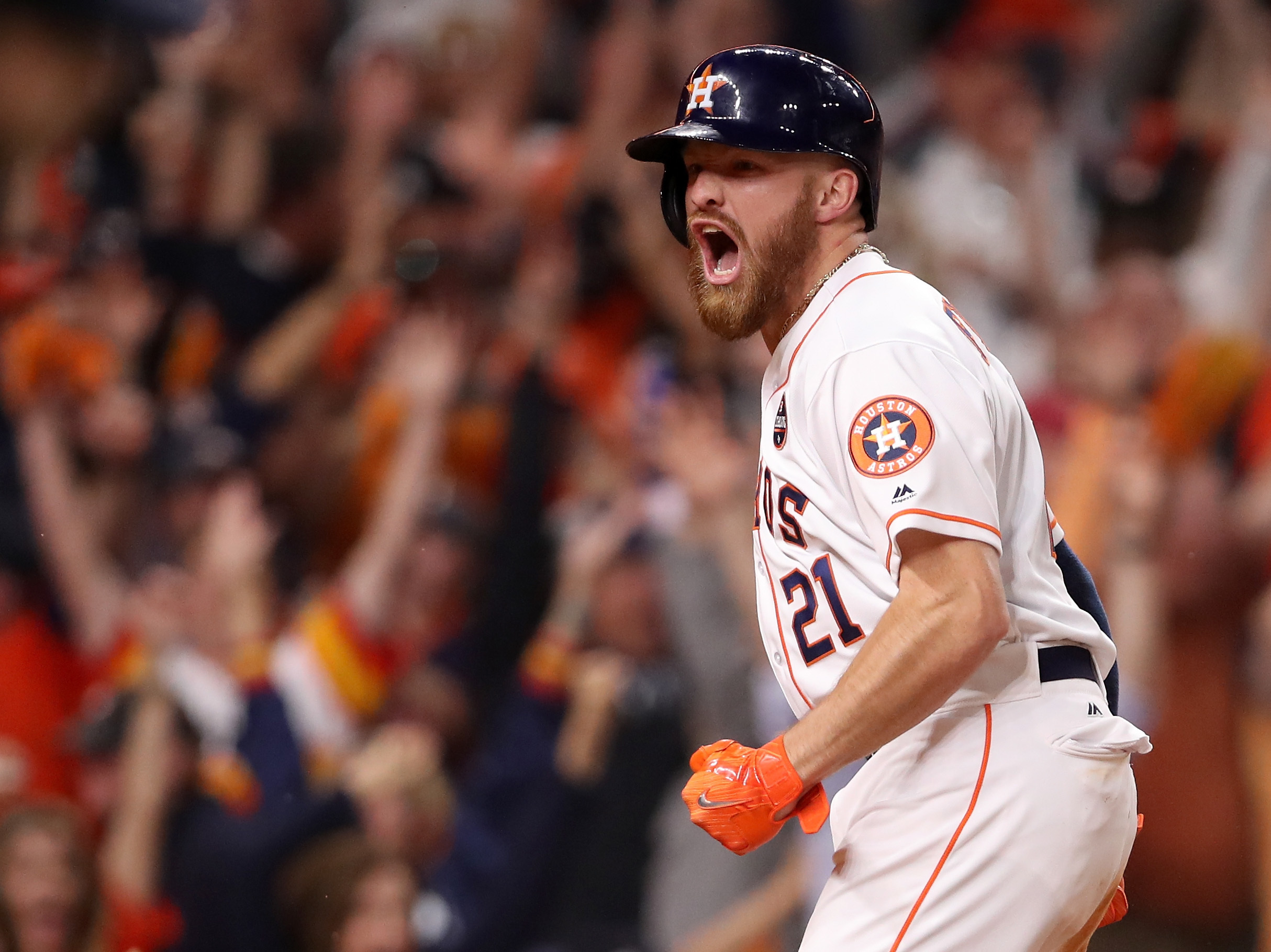 Derek Fisher of the Houston Astros celebrates after scoring the winning run during the 10th inning against the Los Angeles Dodgers in Game 5 of the World Series. (Getty Images)