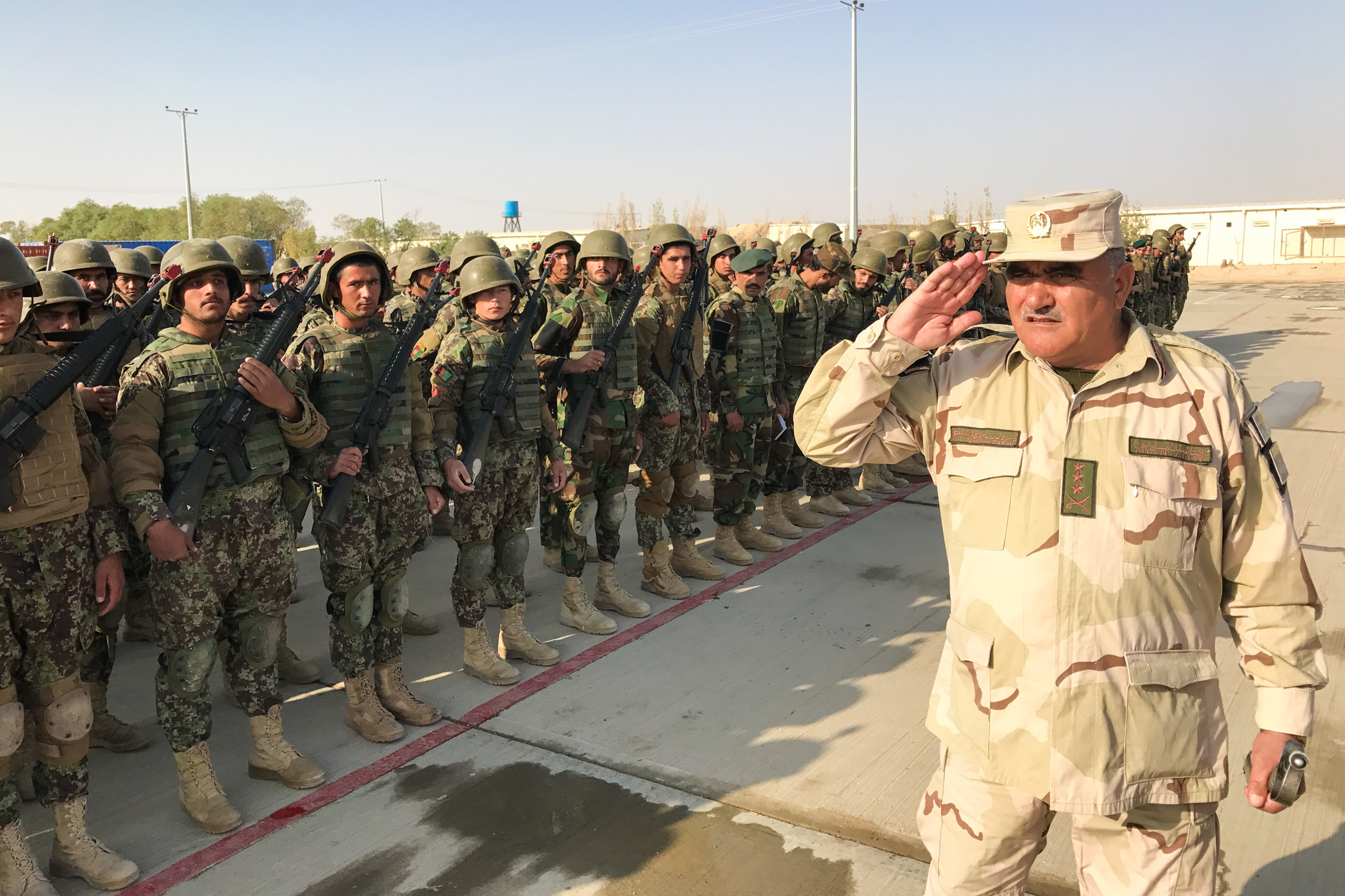 New recruits of the Afghan 215th Corps assemble at Camp Shorabak in Helmand Province. (NPR)