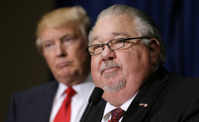 Sam Clovis speaks during a news conference with then-Republican presidential candidate Donald Trump in August 2016. Clovis announced on Thursday he would be withdrawing himself from consideration from a top post at the USDA. (Charlie Neibergall/AP)