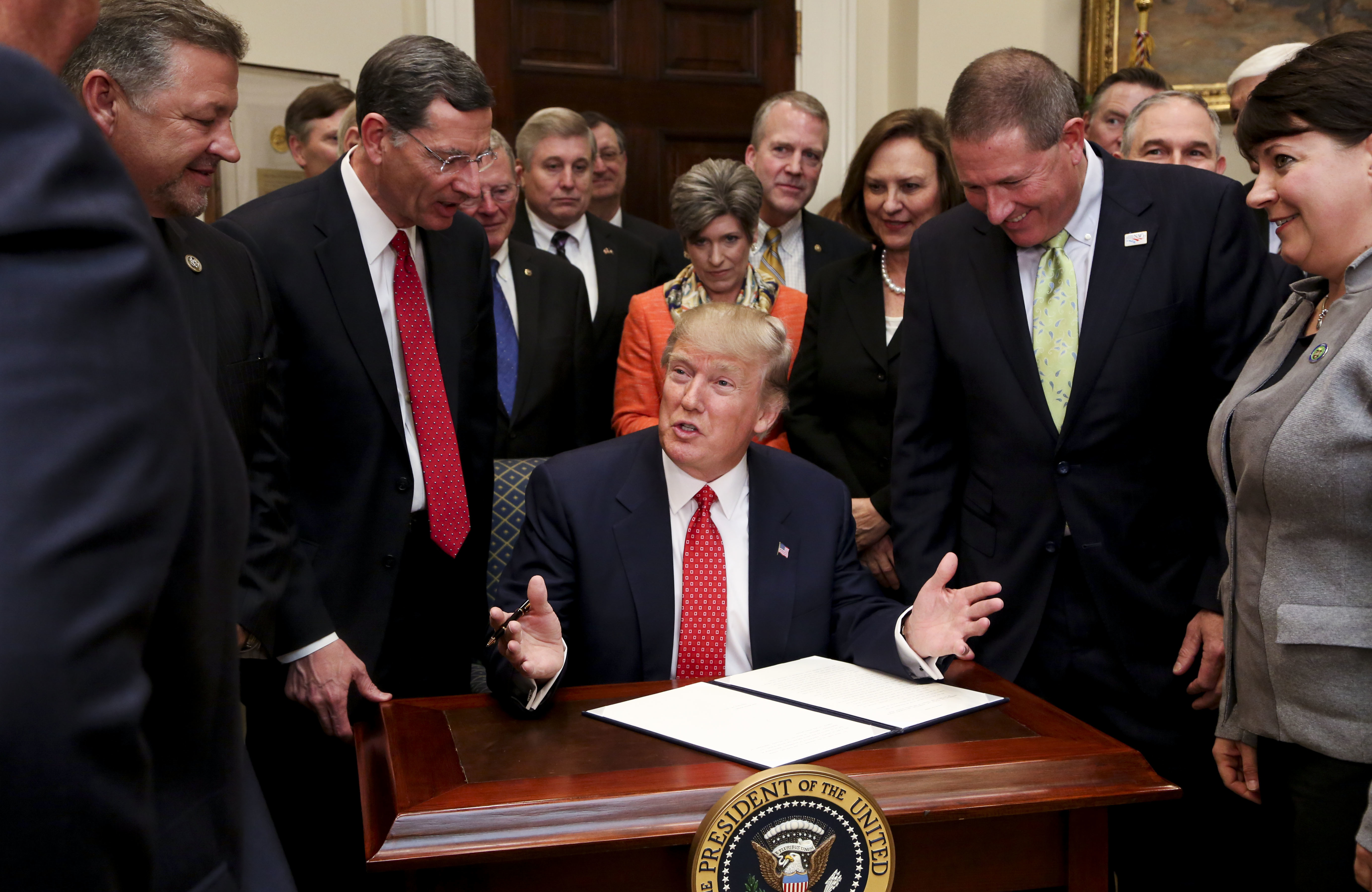 During his tenure as president, Trump has signed a series of executive orders rolling back Obama-era regulations. (Getty Images)