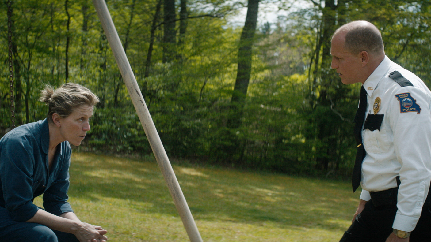Swing and a Diss: Mildred (Frances McDormand) and Willoughby (Woody Harrelson) discuss Mildred's Burma-Shave-inspired quest for justice in <em>Three Billboards Outside Ebbing, Missouri</em>. (Fox Searchlight Pictures)