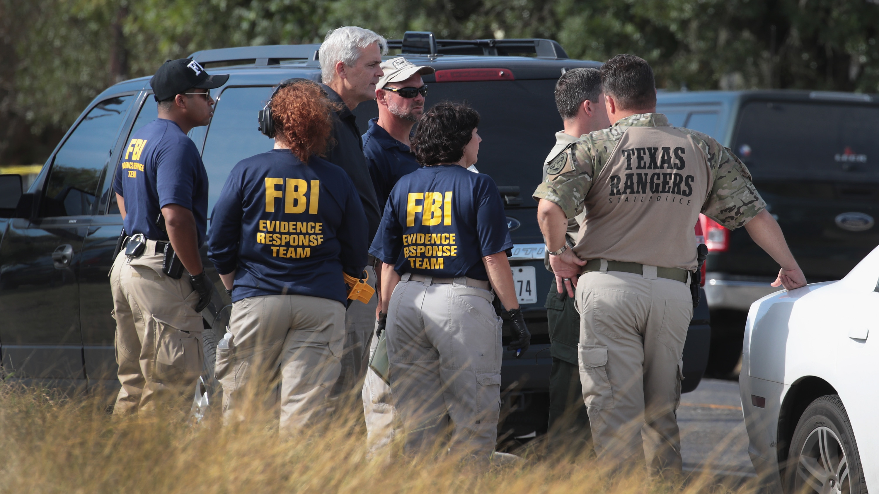 Law enforcement officials continue their investigation at the First Baptist Church of Sutherland Springs in Texas on Monday. (Getty Images)