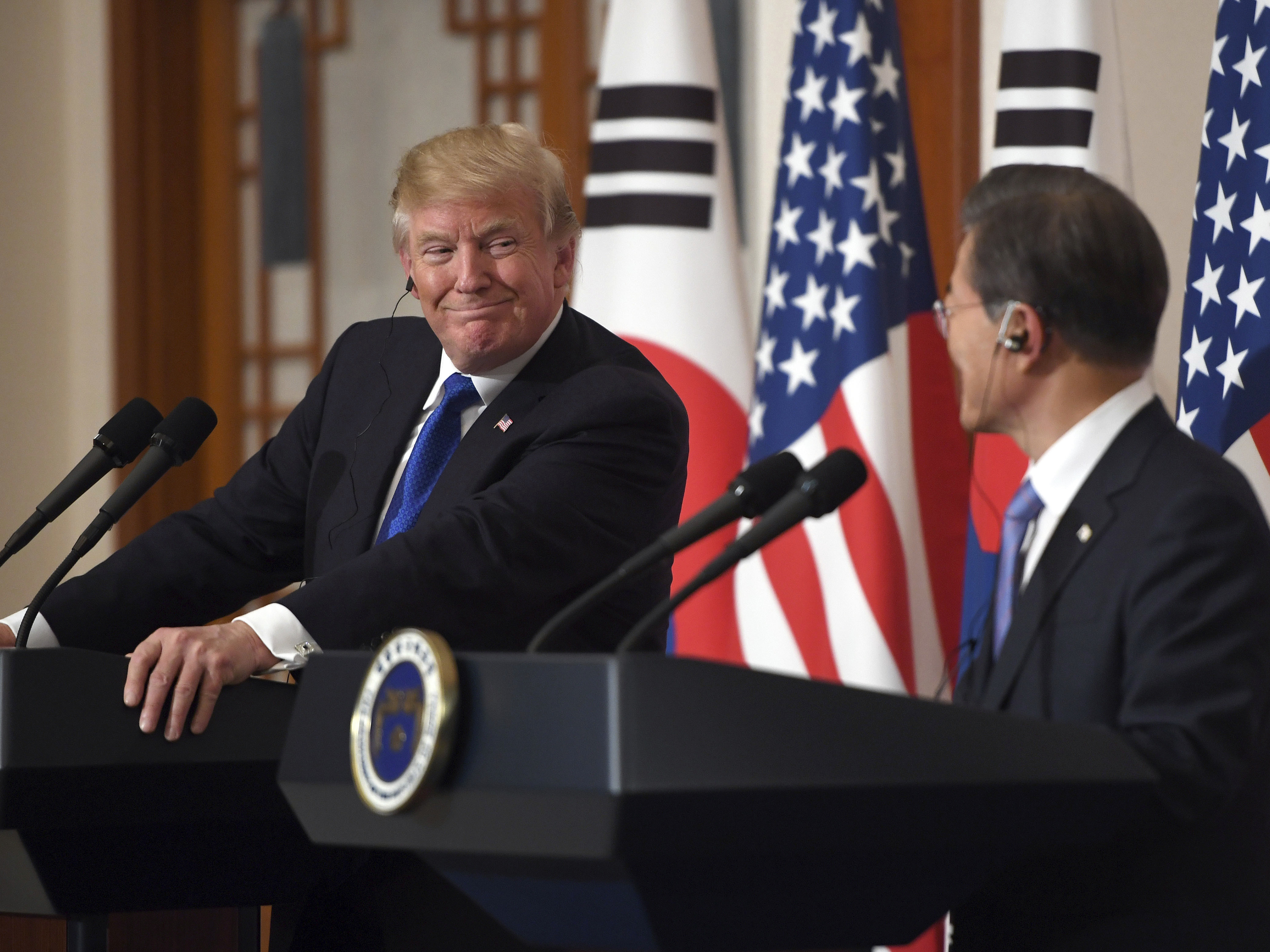 President Donald Trump smiles with South Korean President Moon Jae-in during a joint news conference at the presidential Blue House in Seoul, South Korea, on Tuesday.