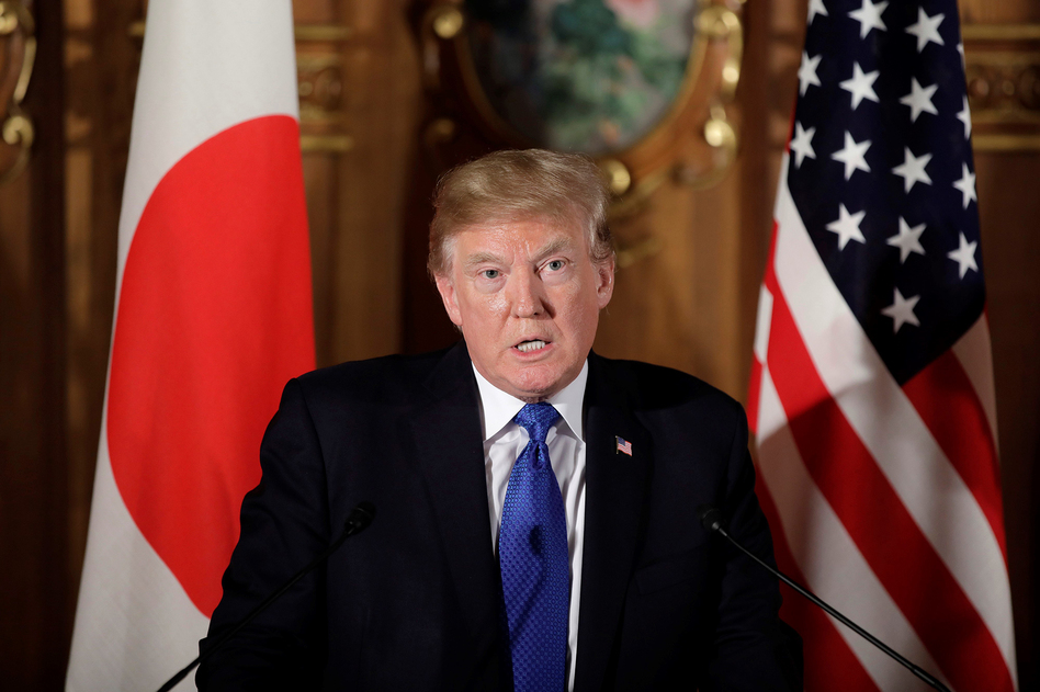 At a press conference in Japan on Monday, President Donald Trump blamed mental illness, not guns, for the Texas massacre. (Anadolu Agency/Getty Images)